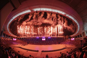 INCHEON, SOUTH KOREA - SEPTEMBER 19:  (EDITORS NOTE: THIS IMAGE WAS CREATED WITH A FISH EYE LENS) Fireworks explode during the Opening Ceremony ahead of the 2014 Asian Games at Incheon Asiad Main Stadium on September 19, 2014 in Incheon, South Korea.  (Ph