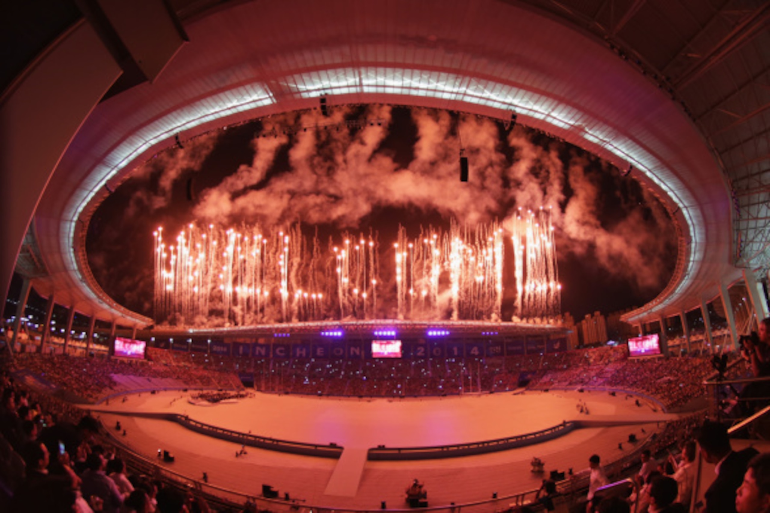 INCHEON, SOUTH KOREA - SEPTEMBER 19:  (EDITORS NOTE: THIS IMAGE WAS CREATED WITH A FISH EYE LENS) Fireworks explode during the Opening Ceremony ahead of the 2014 Asian Games at Incheon Asiad Main Stadium on September 19, 2014 in Incheon, South Korea.  (Ph