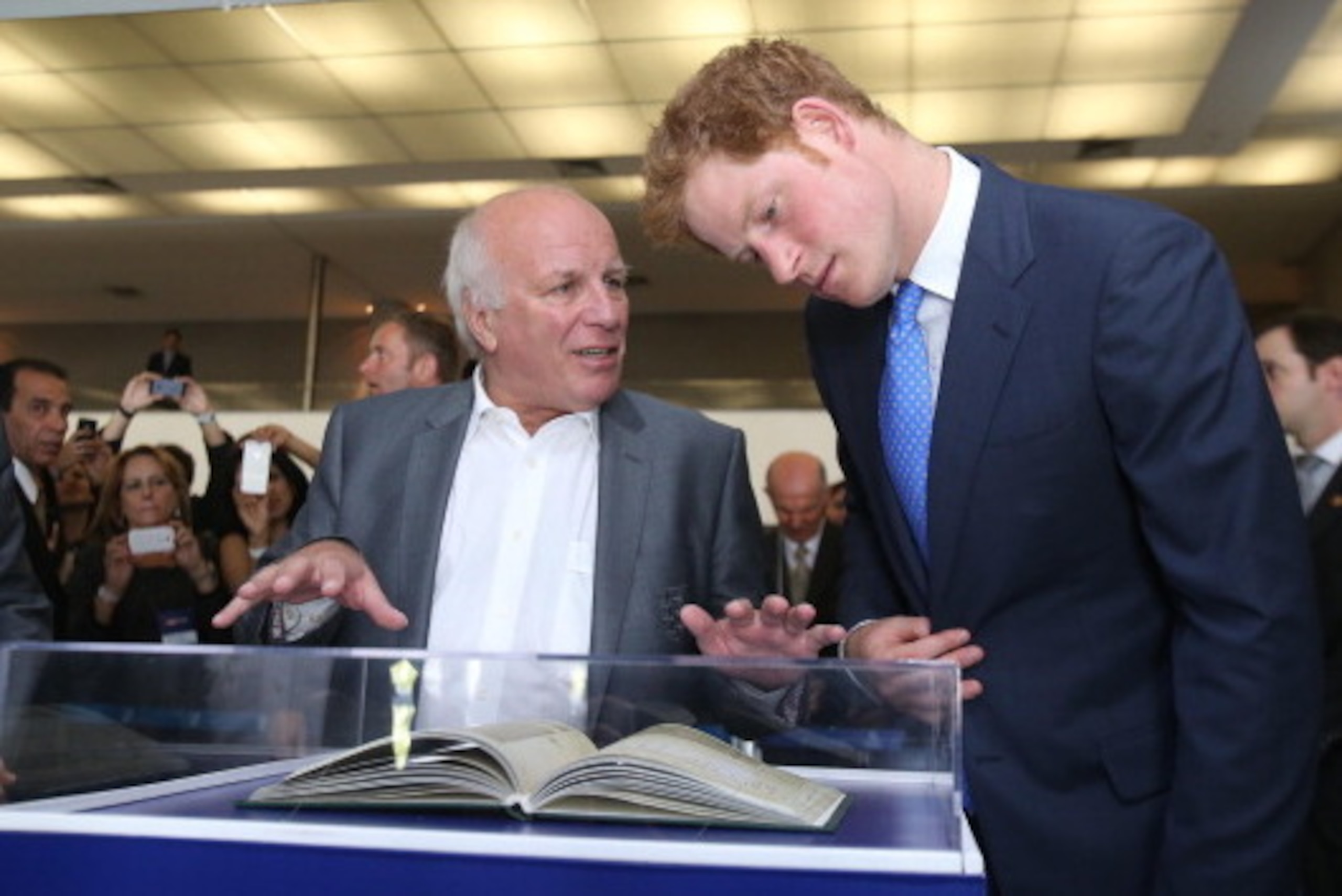 BELO HORIZONTE, BRAZIL - JUNE 24:  Football Association Chairman Greg Dyke shows Prince Harry a copy of the First Rules of Football during a visit to Minas Tenis Clube on the second day of his tour of Brazil on June 24, 2014 in Belo Horizonte, Brazil. Pri