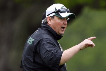 FLORHAM PARK, NJ - MAY 16: Offensive Coordinator Marty Mornhinweg of the New York Jets makes a catch during the first day of rookie minicamp on May 16, 2014 in Florham Park, New Jersey. (Photo by Rich Schultz /Getty Images)