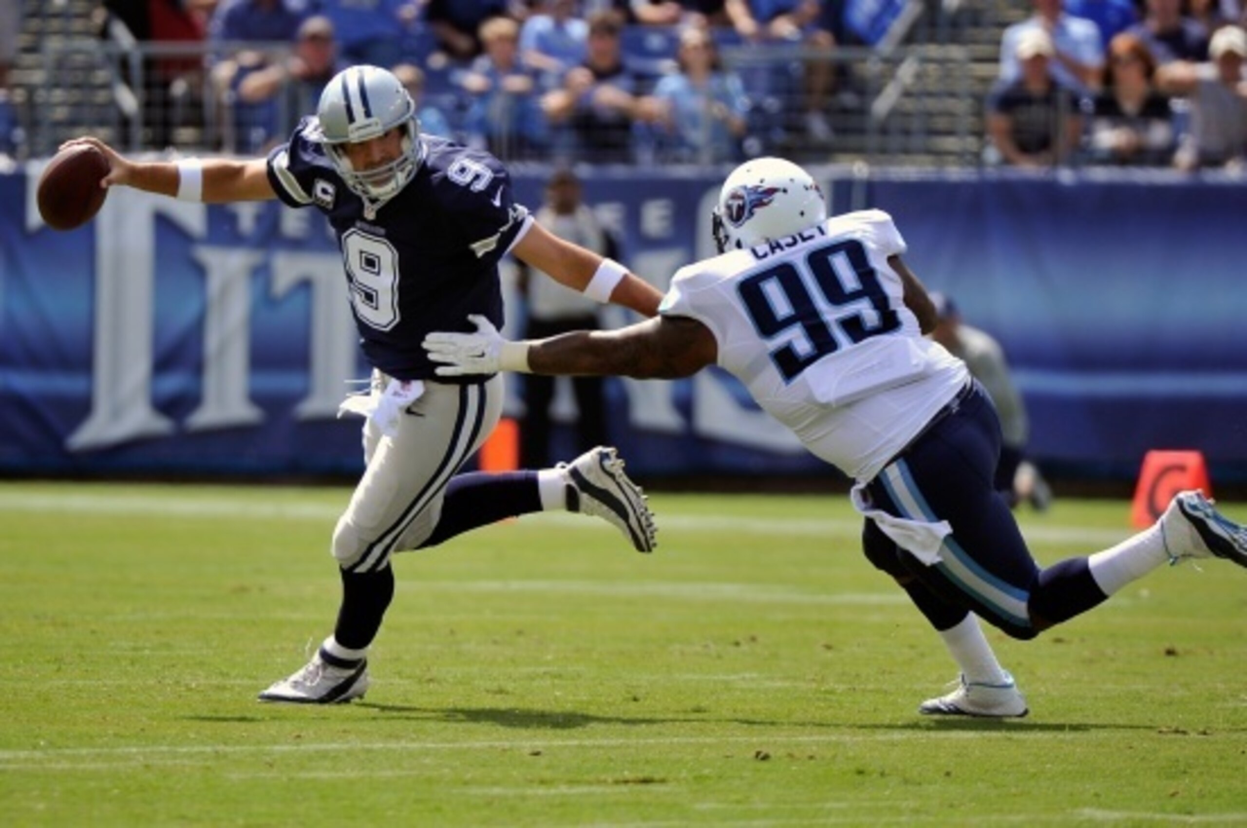 NASHVILLE, TN - SEPTEMBER 14:  Jurrell Casey #99 of the Tennessee Titans sacks Tony Romo #9 of the Dallas Cowboys in the first half at LP Field on September 14, 2014 in Nashville, Tennessee.  (Photo by Frederick Breedon/Getty Images)
