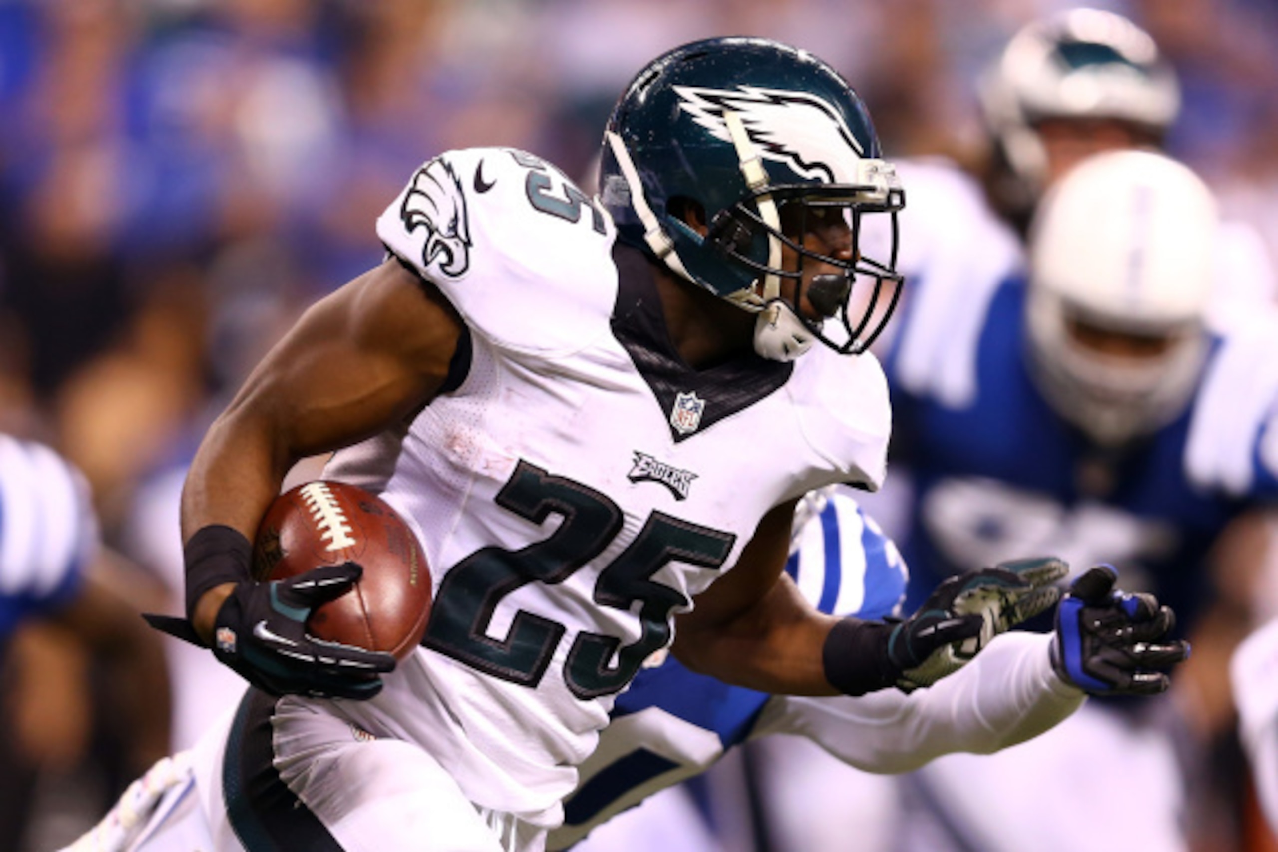 INDIANAPOLIS, IN - SEPTEMBER 15:  Running back LeSean McCoy #25 of the Philadelphia Eagles carries the ball as free safety LaRon Landry #30 of the Indianapolis Colts defends during a game at Lucas Oil Stadium on September 15, 2014 in Indianapolis, Indiana