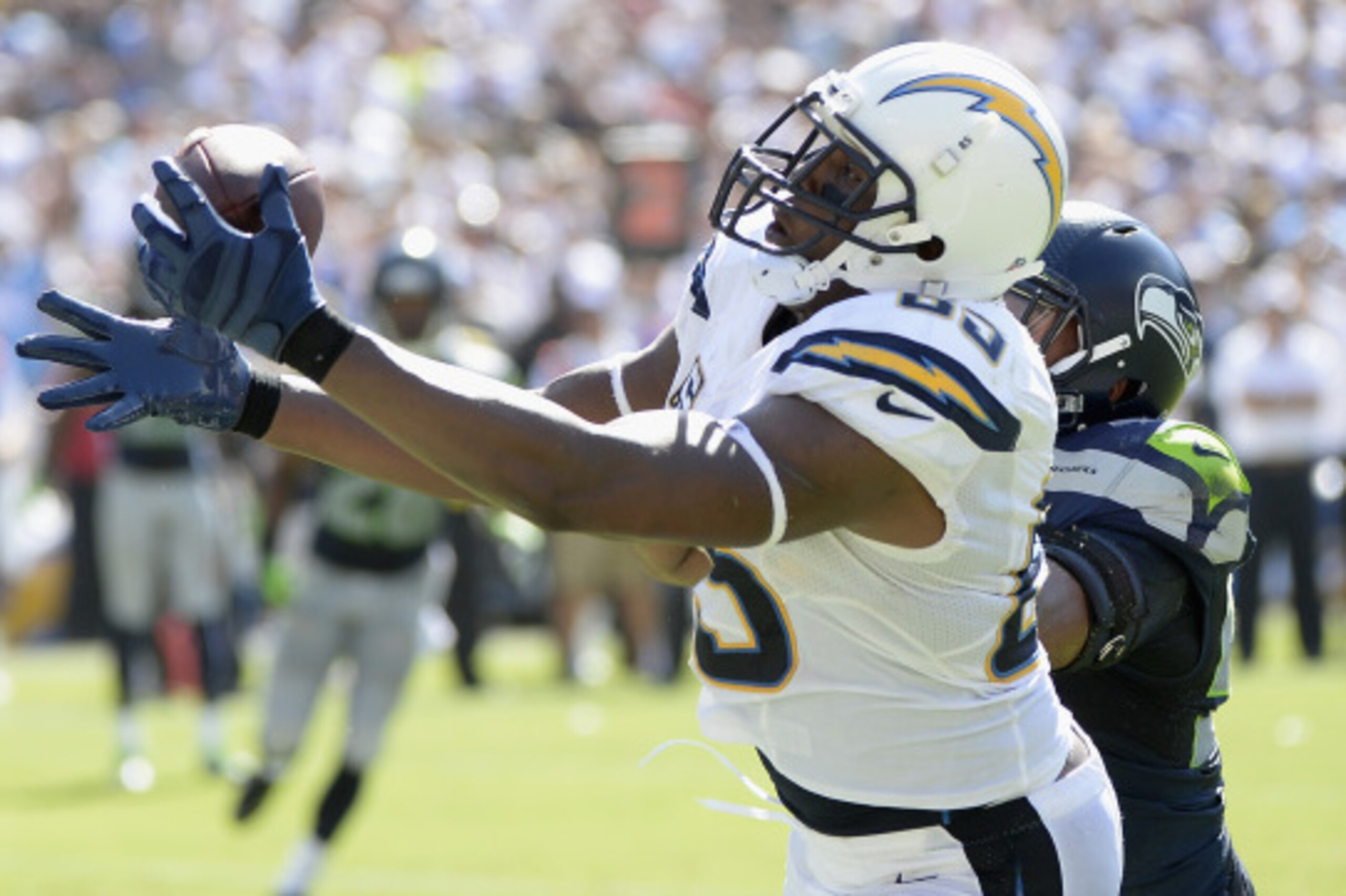 SAN DIEGO, CA - SEPTEMBER 14:  Tight end Antonio Gates #85 of the San Diego Chargers catches a touchdown pass while defended by outside linebacker K.J. Wright #50 of the Seattle Seahawks at Qualcomm Stadium on September 14, 2014 in San Diego, California. 