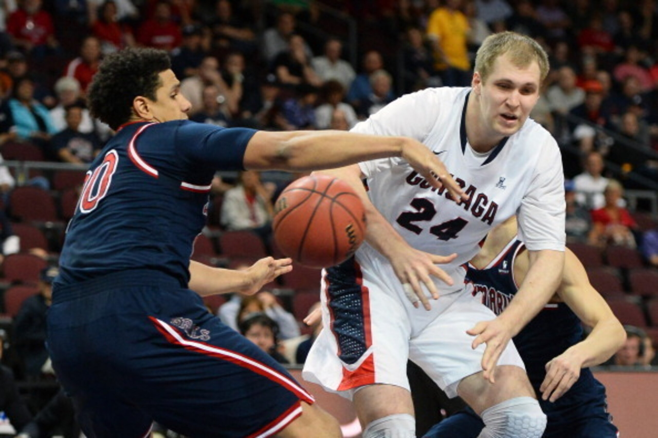 LAS VEGAS, NV - MARCH 10:  Brad Waldow #00 of the Saint Mary's Gaels strips the ball from Przemek Karnowski #24 of the Gonzaga Bulldogs during a semifinal game of the West Coast Conference Basketball tournament at the Orleans Arena on March 10, 2014 in La