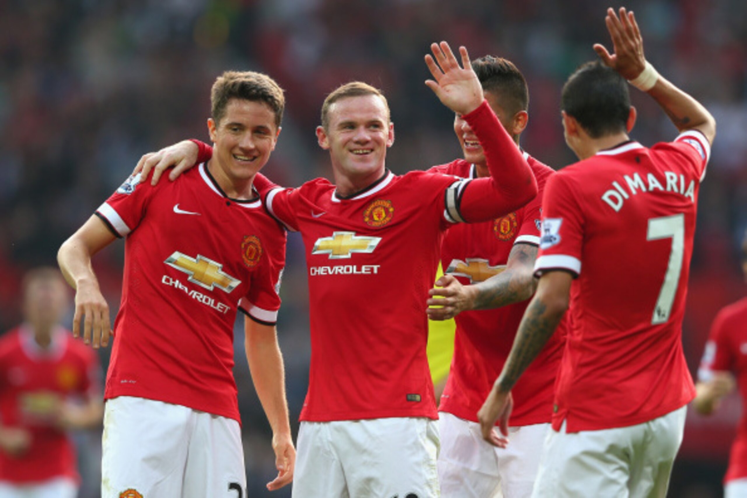 MANCHESTER, ENGLAND - SEPTEMBER 14:  Wayne Rooney of Manchester United celebrates scoring the third goal with team-mates Ander Herrera (L), Marcos Rojo and Angel Di Maria during the Barclays Premier League match between Manchester United and Queens Park R