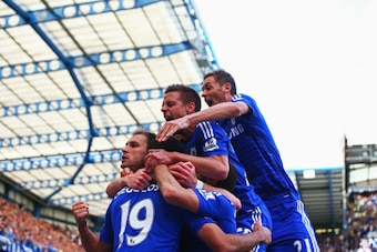 LONDON, ENGLAND - AUGUST 23: Diego Costa of Chelsea is mobbed by team mates after scoring their first goal during the Barclays Premier League match between Chelsea and Leicester City at Stamford Bridge on August 23, 2014 in London, England. (Photo by Pa LONDON, ENGLAND - AUGUST 23: Diego Costa of Chelsea is mobbed by team mates after scoring their first goal during the Barclays Premier League match between Chelsea and Leicester City at Stamford Bridge on August 23, 2014 in London, England. (Photo by Pa