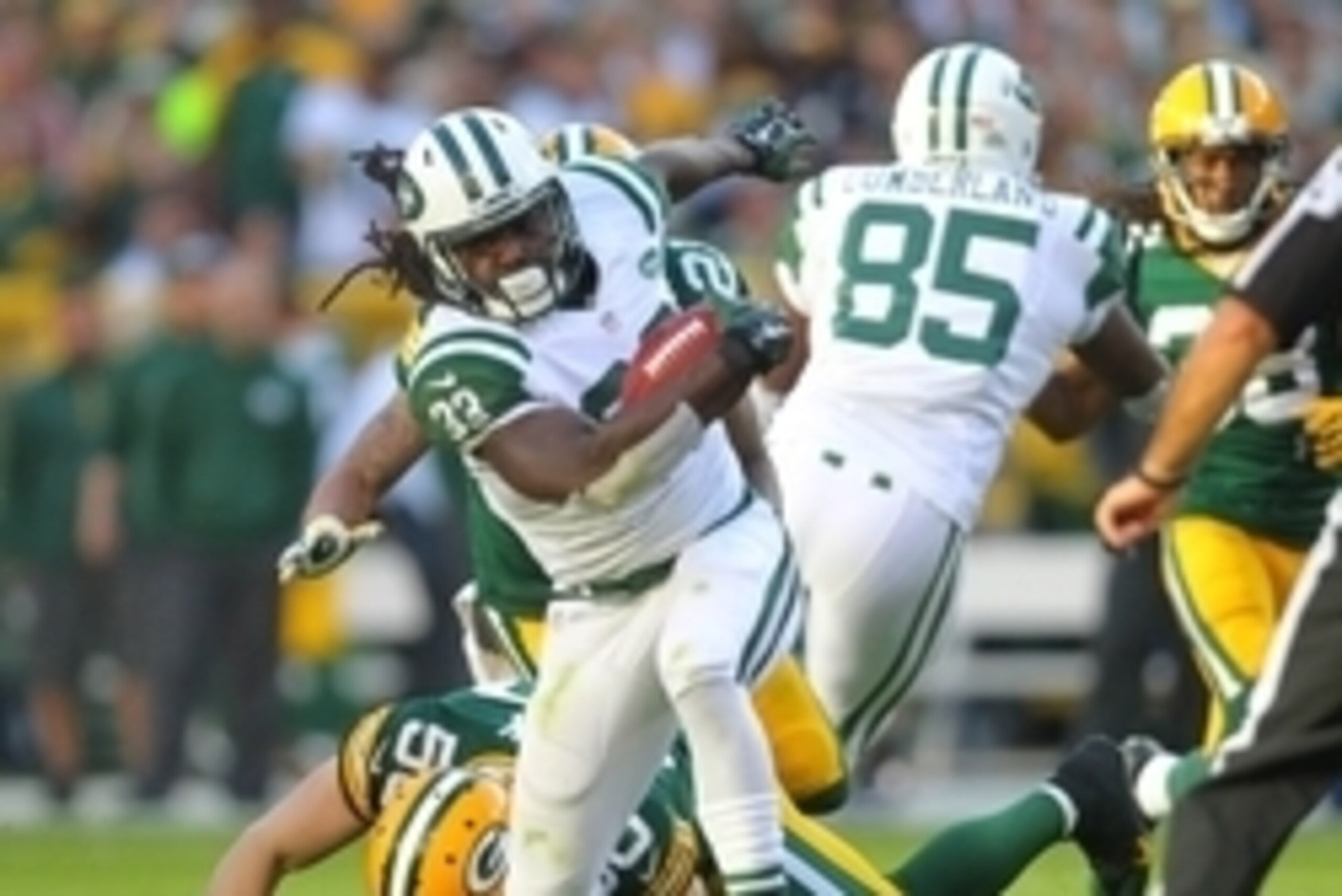Sep 14, 2014; Green Bay, WI, USA; New York Jets running back Chris Ivory (33) is tackled by Green Bay Packers inside linebacker A.J. Hawk (50) during the second half of a game at Lambeau Field. Green Bay won 31-24. Mandatory Credit: Dennis Wierzbicki-USA 