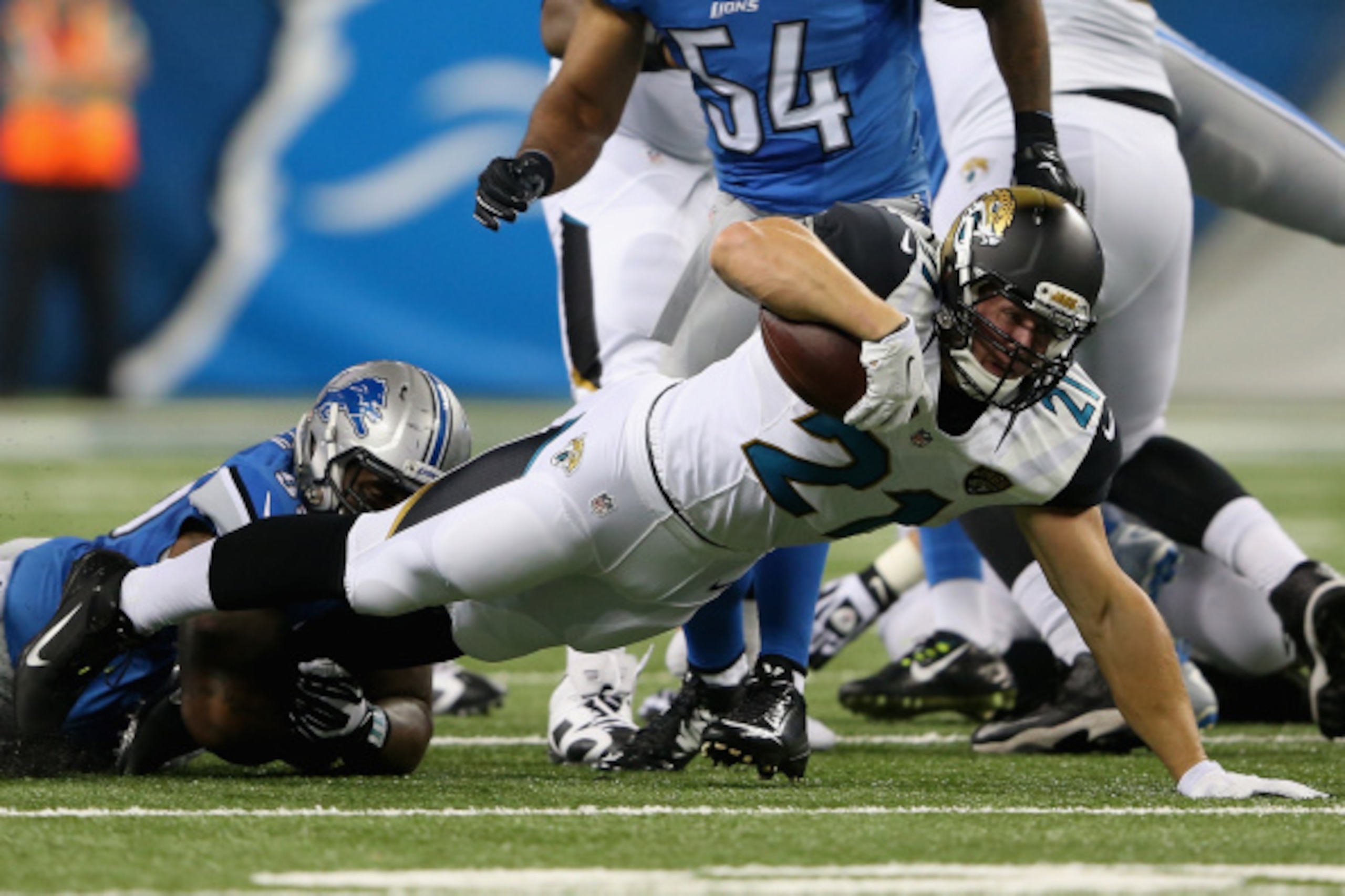 DETROIT, MI - AUGUST 22: Toby Gerhart #21 of the Jacksonville Jaguars is brought down by C.J. Mosley #99 of the Detroit Lions in the first quarter during a preseason game at Ford Field on August 22, 2014 in Detroit, Michigan. (Photo by Leon Halip/Getty Im DETROIT, MI - AUGUST 22: Toby Gerhart #21 of the Jacksonville Jaguars is brought down by C.J. Mosley #99 of the Detroit Lions in the first quarter during a preseason game at Ford Field on August 22, 2014 in Detroit, Michigan. (Photo by Leon Halip/Getty Im
