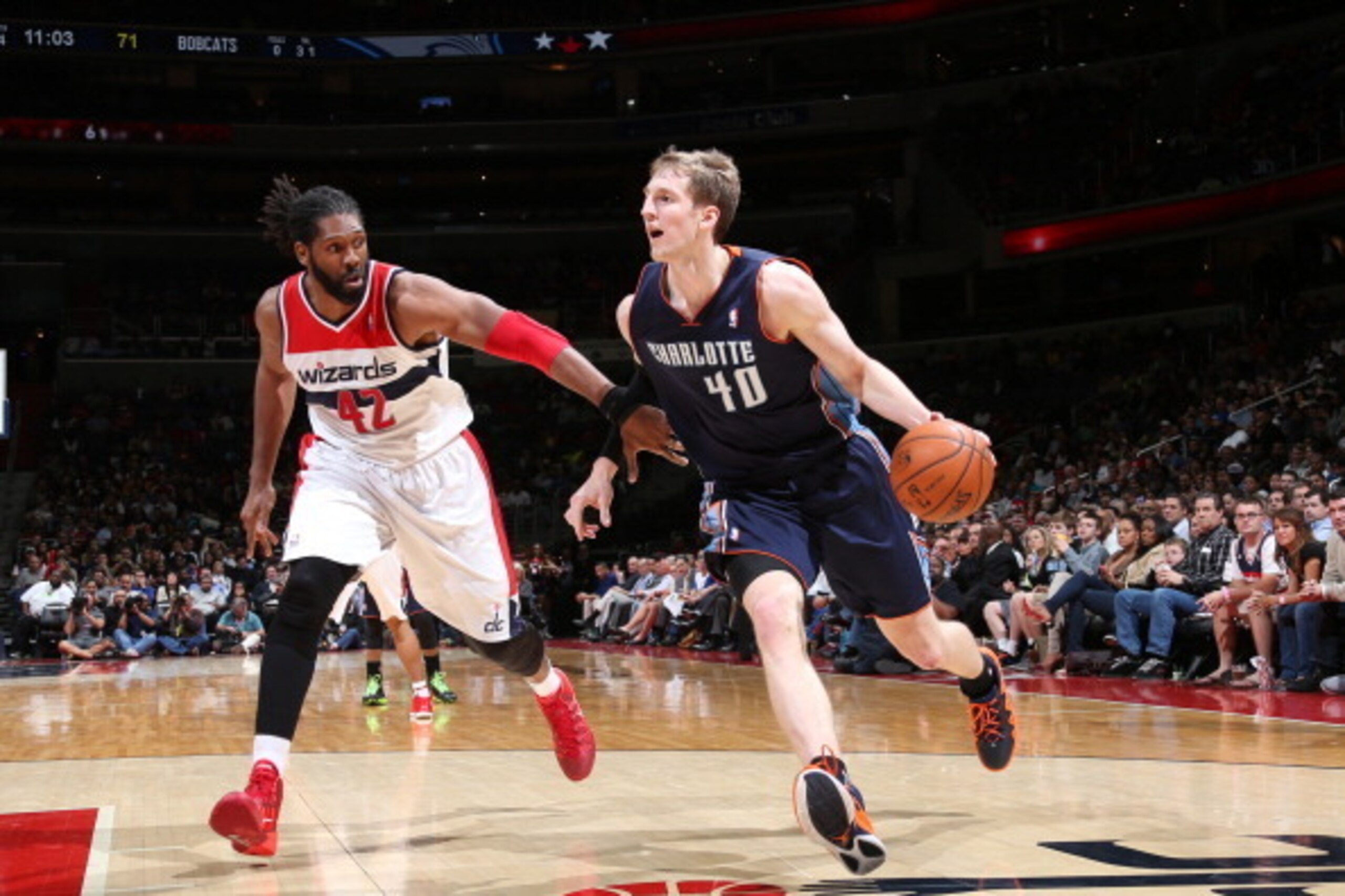 WASHINGTON, DC - APRIL 9: Cody Zeller #40 of the Charlotte Bobcats drives against Nene #42 of the Washington Wizards during the game at the Verizon Center on April 9, 2014 in Washington, DC. NOTE TO USER: User expressly acknowledges and agrees that, by do