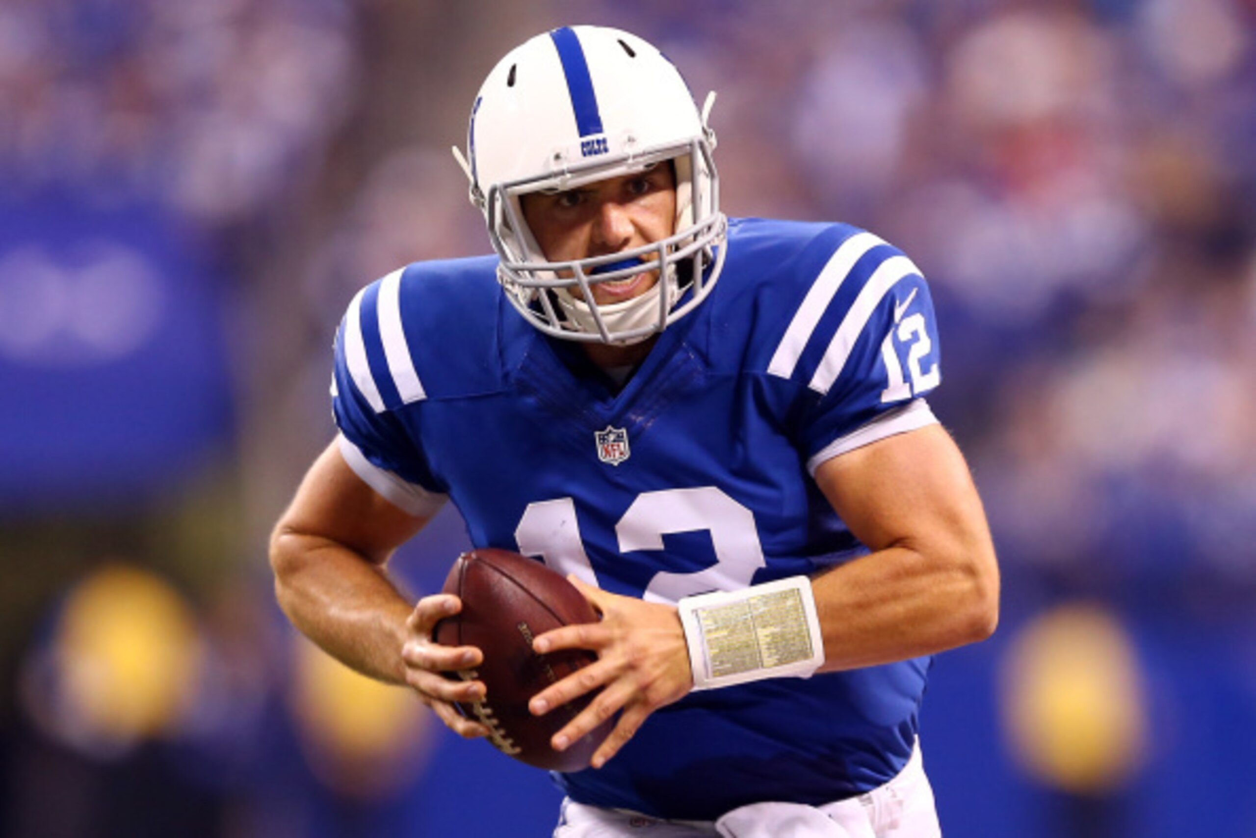 INDIANAPOLIS, IN - SEPTEMBER 15:  Quarterback Andrew Luck #12 of the Indianapolis Colts runs with the ball against the Philadelphia Eagles during a game at Lucas Oil Stadium on September 15, 2014 in Indianapolis, Indiana.  (Photo by Andy Lyons/Getty Image