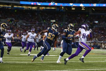 ST. LOUIS, MO - SEPTEMBER 7: Cordarrelle Patterson #84 of the Minnesota Vikings runs past Alec Ogletree #52 and Michael Brockers #90 of the St. Louis Rams on his way to scoring a touchdown at the Edward Jones Dome on September 7, 2014 in St. Louis, Missou