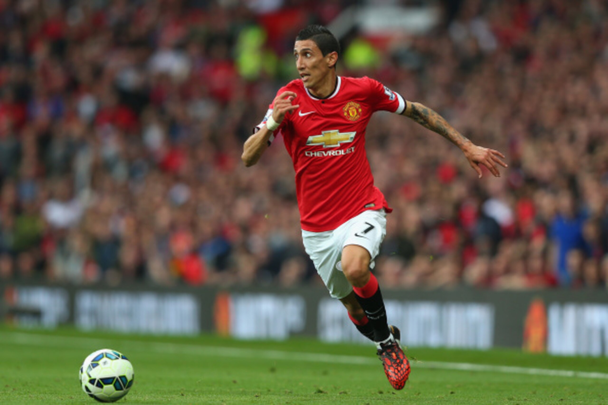 MANCHESTER, ENGLAND - SEPTEMBER 14:  Angel Di Maria of Manchester United in action during the Barclays Premier League match between Manchester United and Queens Park Rangers at Old Trafford on September 14, 2014 in Manchester, England.  (Photo by Alex Liv