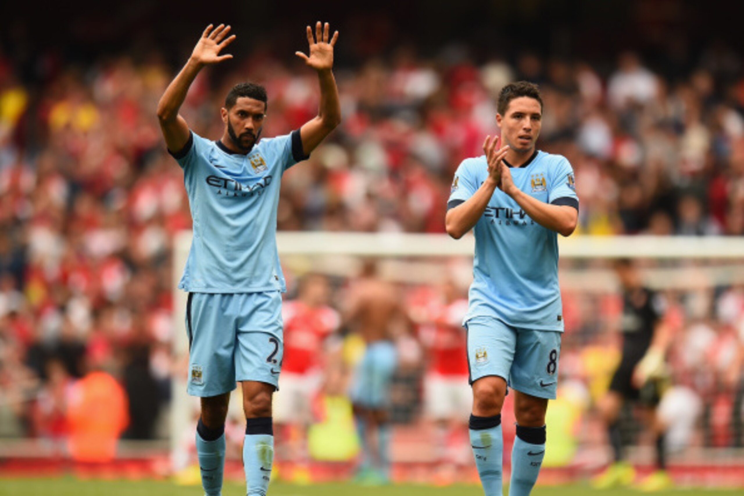 LONDON, ENGLAND - SEPTEMBER 13:  Gael Clichy and Samir Nasri of Manchester City acknowledge the crowd after the Barclays Premier League match between Arsenal and Manchester City at Emirates Stadium on September 13, 2014 in London, England.  (Photo by Shau