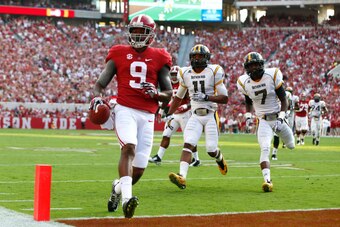 TUSCALOOSA, AL - SEPTEMBER 13:  Amari Cooper #9 of the Alabama Crimson Tide takes a reception in for a touchdown against the Southern Miss Golden Eagles at Bryant-Denny Stadium on September 13, 2014 in Tuscaloosa, Alabama.  (Photo by Kevin C. Cox/Getty Im