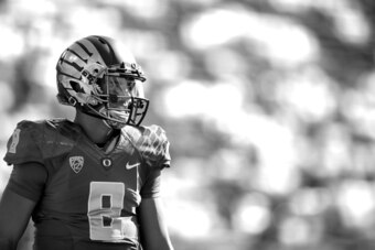 EUGENE, OR - SEPTEMBER 13:  (Editor's Note: This image has been converted to black and white.) Quarterback Marcus Mariota #8 of the Oregon Ducks during pregame warm up against the Wyoming Cowboys at Autzen Stadium on September 1w, 2014  in Eugene, Oregon.