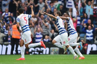 LONDON, ENGLAND - SEPTEMBER 20:  Niko Kranjcar (2ndR) of QPR celebrates scoring with a free kick during the Barclays Premier League match between Queens Park Rangers and Stoke City at Loftus Road on September 20, 2014 in London, England.  (Photo by Jamie 