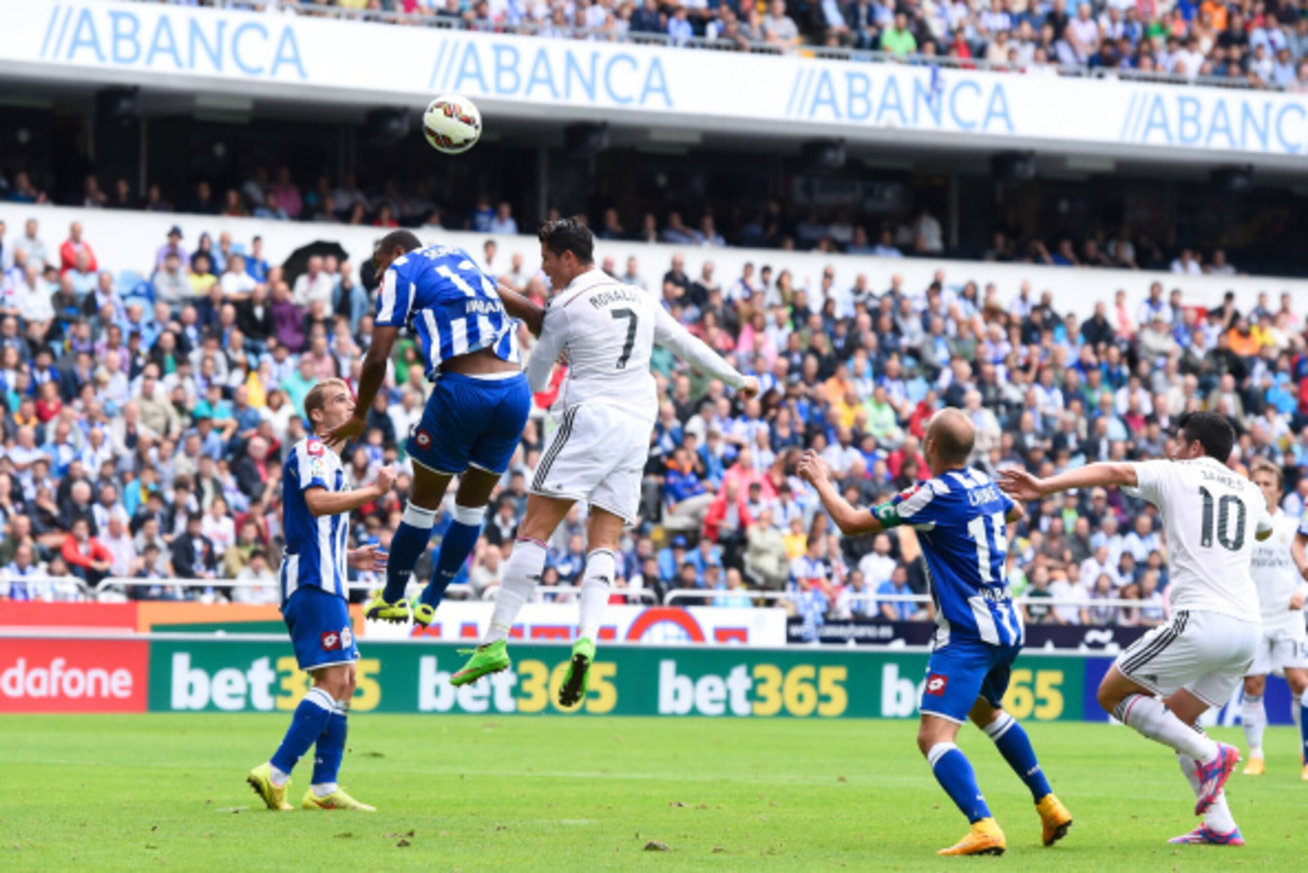 LA CORUNA, SPAIN - SEPTEMBER 20: Cristiano Ronaldo of Real Madrid CF scores the opening goal during the La Liga match between RC Deportivo La Coruna and Real Madrid CF at Riazor Stadium on September 20, 2014 in La Coruna, Spain. (Photo by David Ramos/Ge LA CORUNA, SPAIN - SEPTEMBER 20: Cristiano Ronaldo of Real Madrid CF scores the opening goal during the La Liga match between RC Deportivo La Coruna and Real Madrid CF at Riazor Stadium on September 20, 2014 in La Coruna, Spain. (Photo by David Ramos/Ge