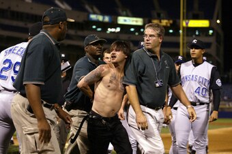 The aftermath of the incident in which Royals first base coach Tom Gamboa was attacked on the field by two fans.