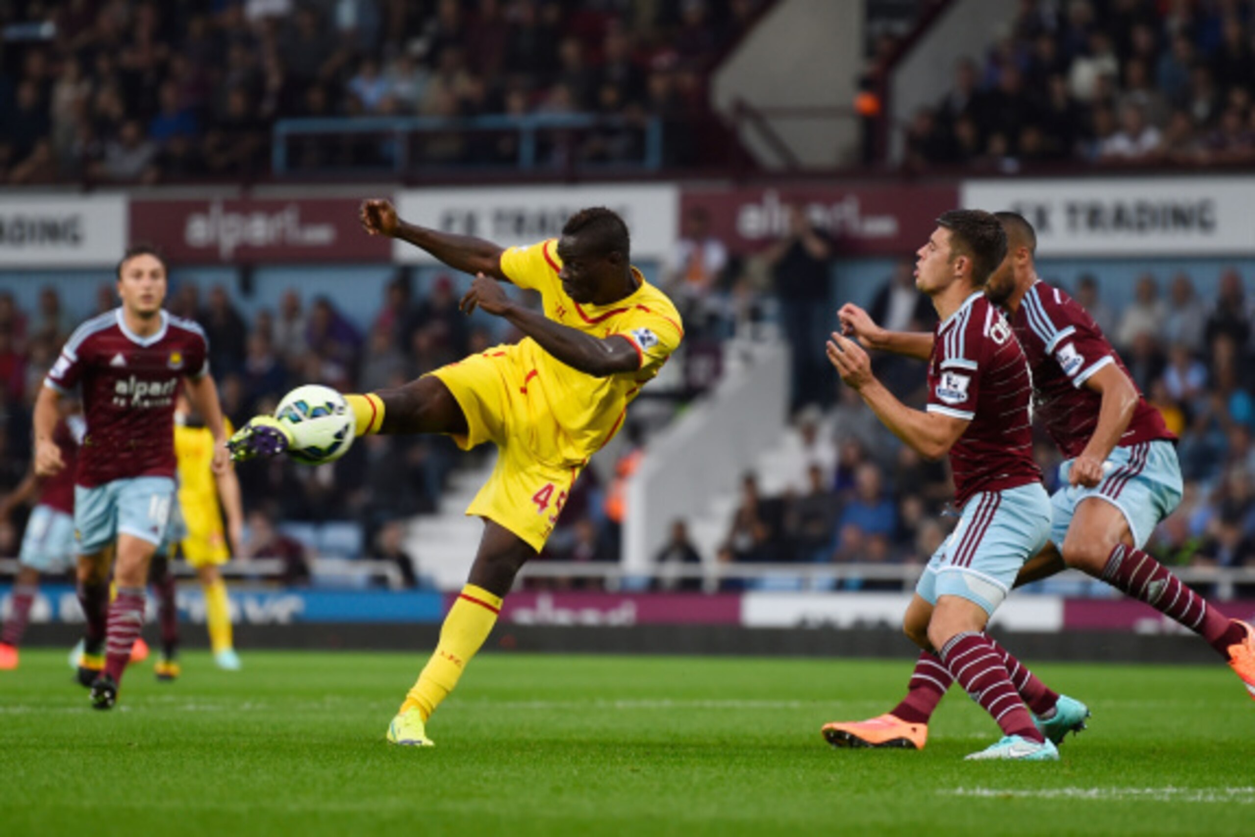 LONDON, ENGLAND - SEPTEMBER 20:  Mario Balotelli of Liverpool takes a sot on goal during the Barclays Premier League match between West Ham United and Liverpool at Boleyn Ground on September 20, 2014 in London, England.  (Photo by Mike Hewitt/Getty Images