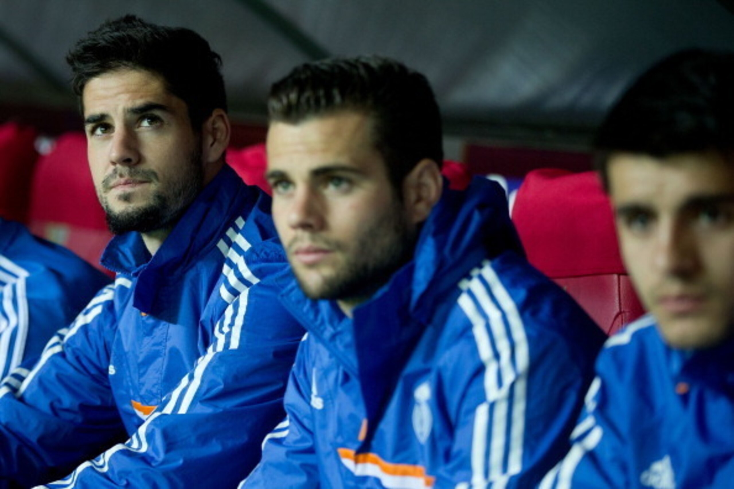 SEVILLE, SPAIN - MARCH 26: Francisco Roman Alarcon alias Isco (L) of Real Madrid CF looks on sitted on the bench close to his teammates Nacho Fernandez (2ndL) and Alvaro B. Morata (R) prior to start the La Liga match between Sevilla FC and Real Madrid CF 