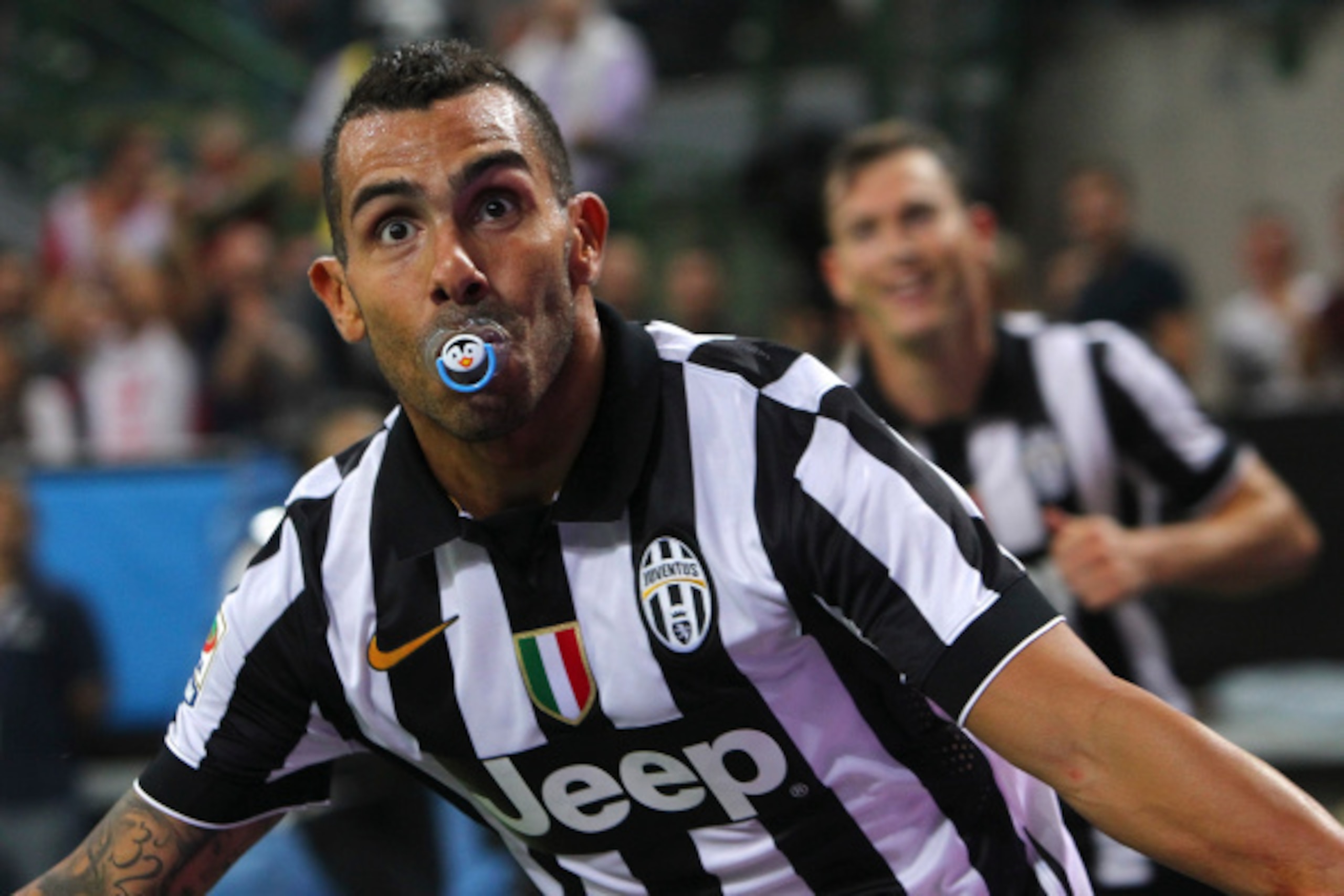 MILAN, ITALY - SEPTEMBER 20:  Carlos Tevez of Juventus FC celebrates after scoring the opening goal during the Serie A match between AC Milan and Juventus FC at Stadio Giuseppe Meazza on September 20, 2014 in Milan, Italy.  (Photo by Marco Luzzani/Getty I