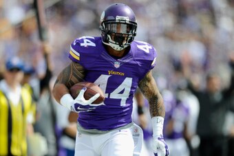 MINNEAPOLIS, MN - SEPTEMBER 14: Matt Asiata #44 of the Minnesota Vikings carries the ball during the first quarter of the game against the New England Patriots on September 14, 2014 at TCF Bank Stadium in Minneapolis, Minnesota. Asiata scored a touchdown 