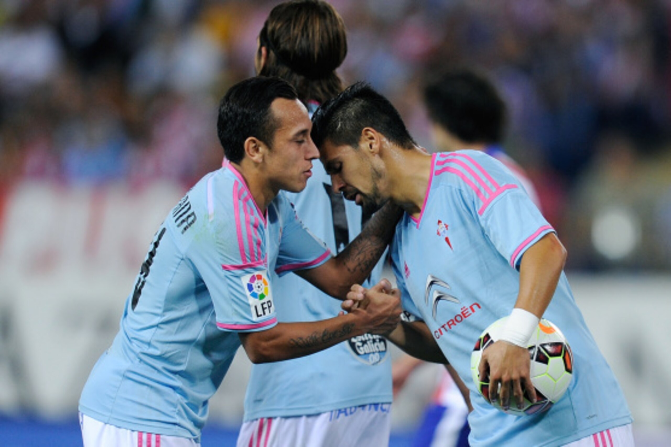 MADRID, SPAIN - SEPTEMBER 20:  Fabian Orellano (L) of Real Club Celta de Vigo  celebrates with teammate  Manuel Agudo Nolito during the La Liga match between Club Atletico de Madrid and Real Club Celta de Vigo at the Vicente Calderon stadium on September 