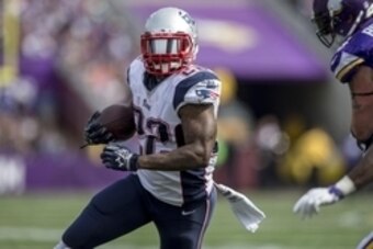 Sep 14, 2014; Minneapolis, MN, USA; New England Patriots running back Stevan Ridley (22) rushes against the Minnesota Vikings in the third quarter at TCF Bank Stadium. The Patriots win 30-7. Mandatory Credit: Bruce Kluckhohn-USA TODAY Sports