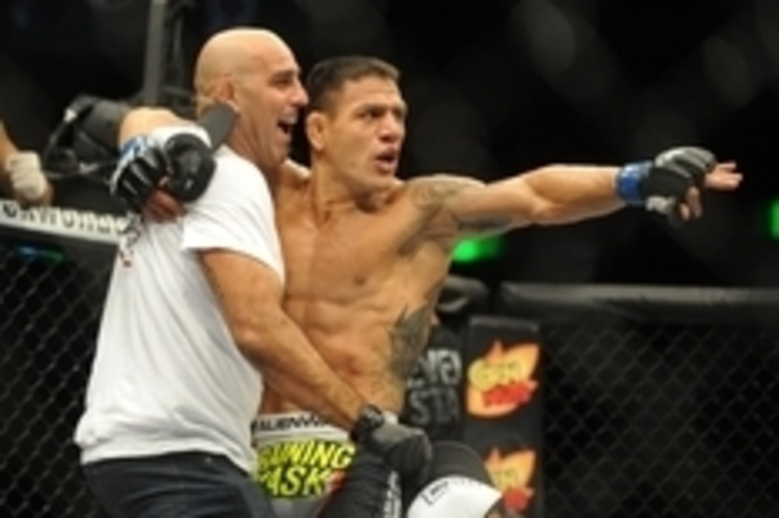 Aug 23, 2014; Tulsa, OK, USA; Rafael Dos Anjos (blue gloves) celebrates after defeating Benson Henderson in the Main Event, Lightweight Bout at BOK Center. Mandatory Credit: Mark D. Smith-USA TODAY Sports