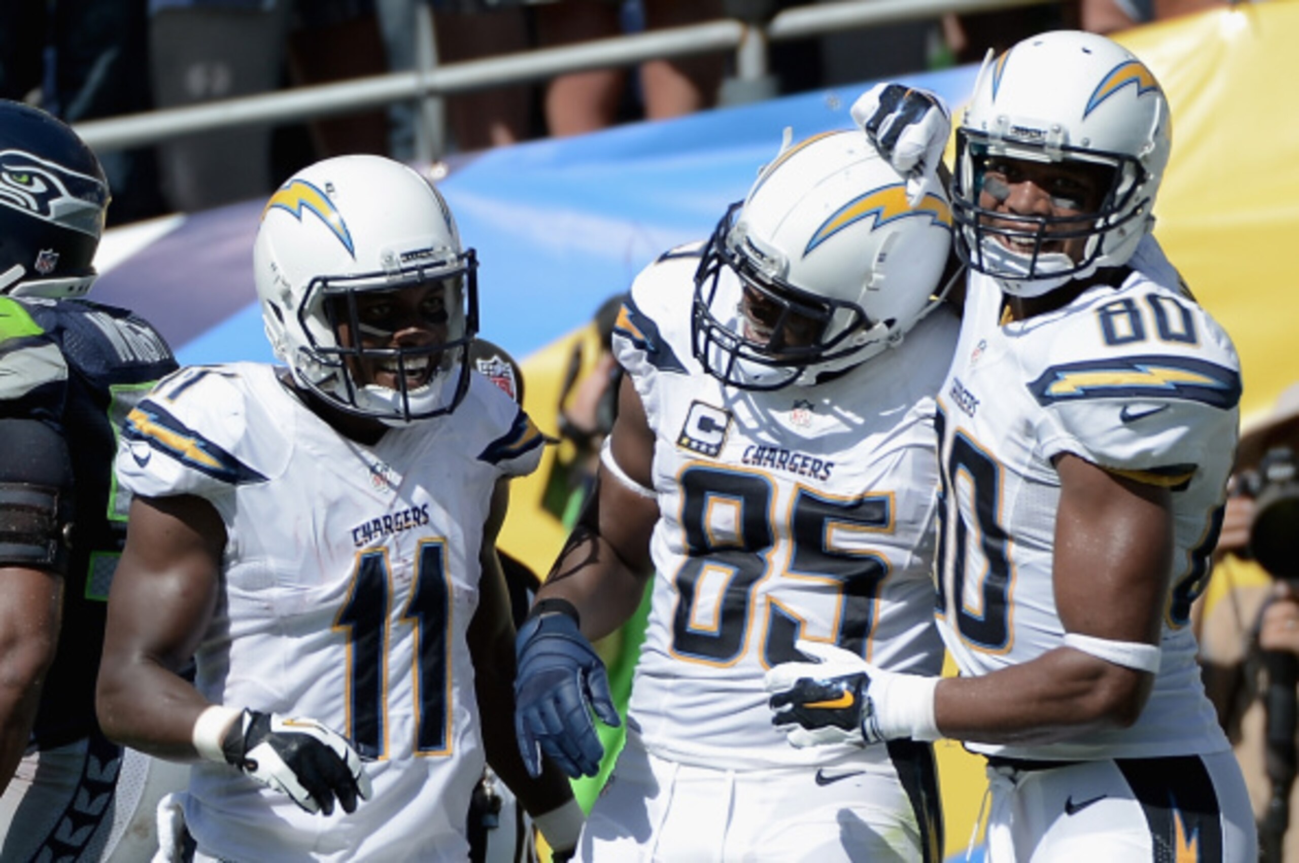 SAN DIEGO, CA - SEPTEMBER 14:  Tight end Antonio Gates #85 of the San Diego Chargers is congratulated after scoring a touchdown by teammates wide receiver Eddie Royal #11 of the San Diego Chargers and wide receiver Malcom Floyd #80 of the San Diego Charge