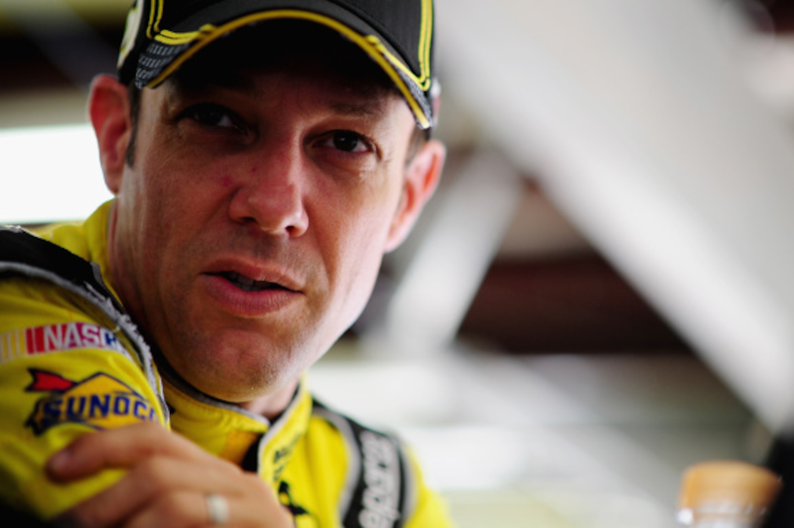 LOUDON, NH - SEPTEMBER 19:  Matt Kenseth, driver of the #20 Dollar General Toyota, stands in the garage area during practice for the NASCAR Sprint Cup Series Sylvania 300 at New Hampshire Motor Speedway on September 19, 2014 in Loudon, New Hampshire.  (Ph