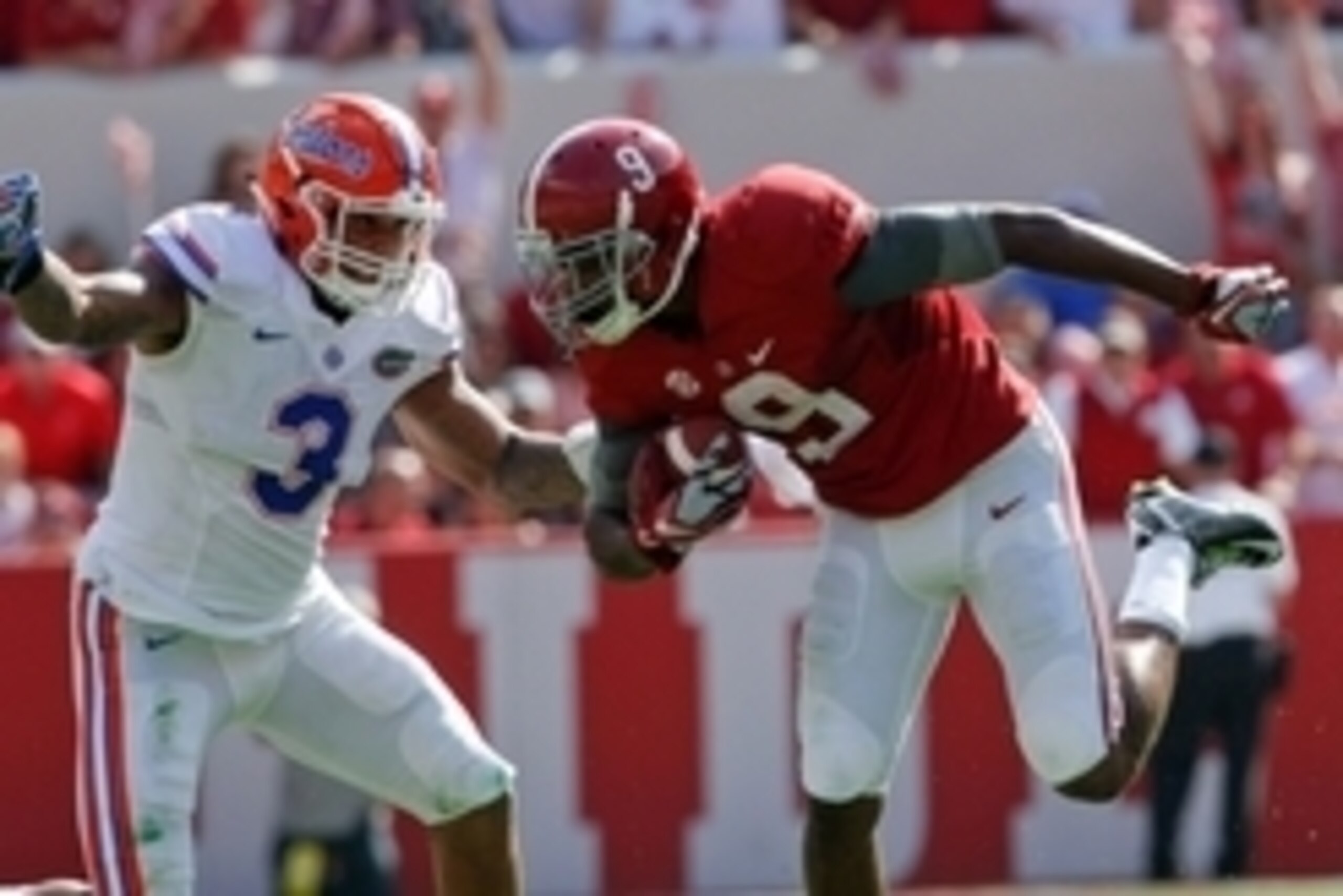 Sep 20, 2014; Tuscaloosa, AL, USA; Alabama Crimson Tide wide receiver Amari Cooper (9) carries the ball as Florida Gators linebacker Antonio Morrison (3) pursues him at Bryant-Denny Stadium. Mandatory Credit: Marvin Gentry-USA TODAY Sports