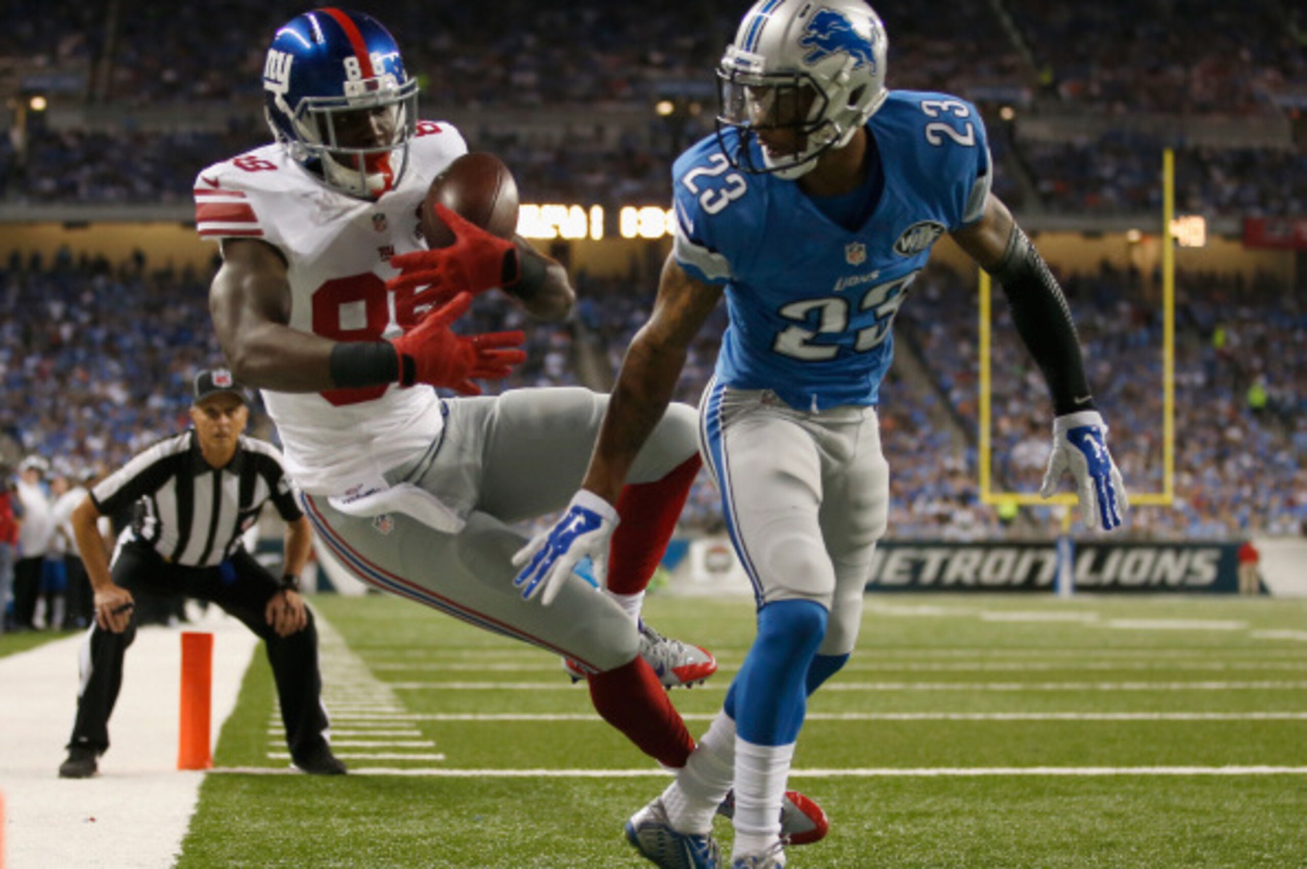 DETROIT, MI - SEPTEMBER 08: Corey Washington #88 of the New York Giants can't come up with a second quarter touchdown catch while being defended by Darius Slay #23 of the Detroit Lions at Ford Field on September 8, 2014 in Detroit, Michigan. (Photo by Gre