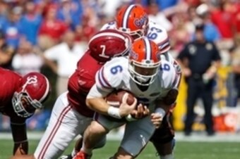 Sep 20, 2014; Tuscaloosa, AL, USA; Florida Gators quarterback Jeff Driskel (6) is tackled by Alabama Crimson Tide linebacker Ryan Anderson (7)  at Bryant-Denny Stadium. Mandatory Credit: Marvin Gentry-USA TODAY Sports
