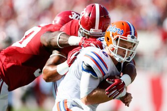 TUSCALOOSA, AL - SEPTEMBER 20:  Trey DePriest #33 and Denzel Devall #30 of the Alabama Crimson Tide tackle Jeff Driskel #6 of the Florida Gators at Bryant-Denny Stadium on September 20, 2014 in Tuscaloosa, Alabama.  (Photo by Kevin C. Cox/Getty Images)