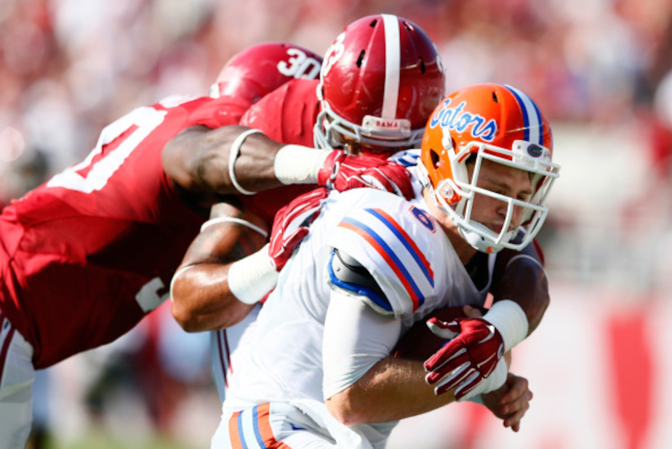 TUSCALOOSA, AL - SEPTEMBER 20: Trey DePriest #33 and Denzel Devall #30 of the Alabama Crimson Tide tackle Jeff Driskel #6 of the Florida Gators at Bryant-Denny Stadium on September 20, 2014 in Tuscaloosa, Alabama. (Photo by Kevin C. Cox/Getty Images) TUSCALOOSA, AL - SEPTEMBER 20: Trey DePriest #33 and Denzel Devall #30 of the Alabama Crimson Tide tackle Jeff Driskel #6 of the Florida Gators at Bryant-Denny Stadium on September 20, 2014 in Tuscaloosa, Alabama. (Photo by Kevin C. Cox/Getty Images)