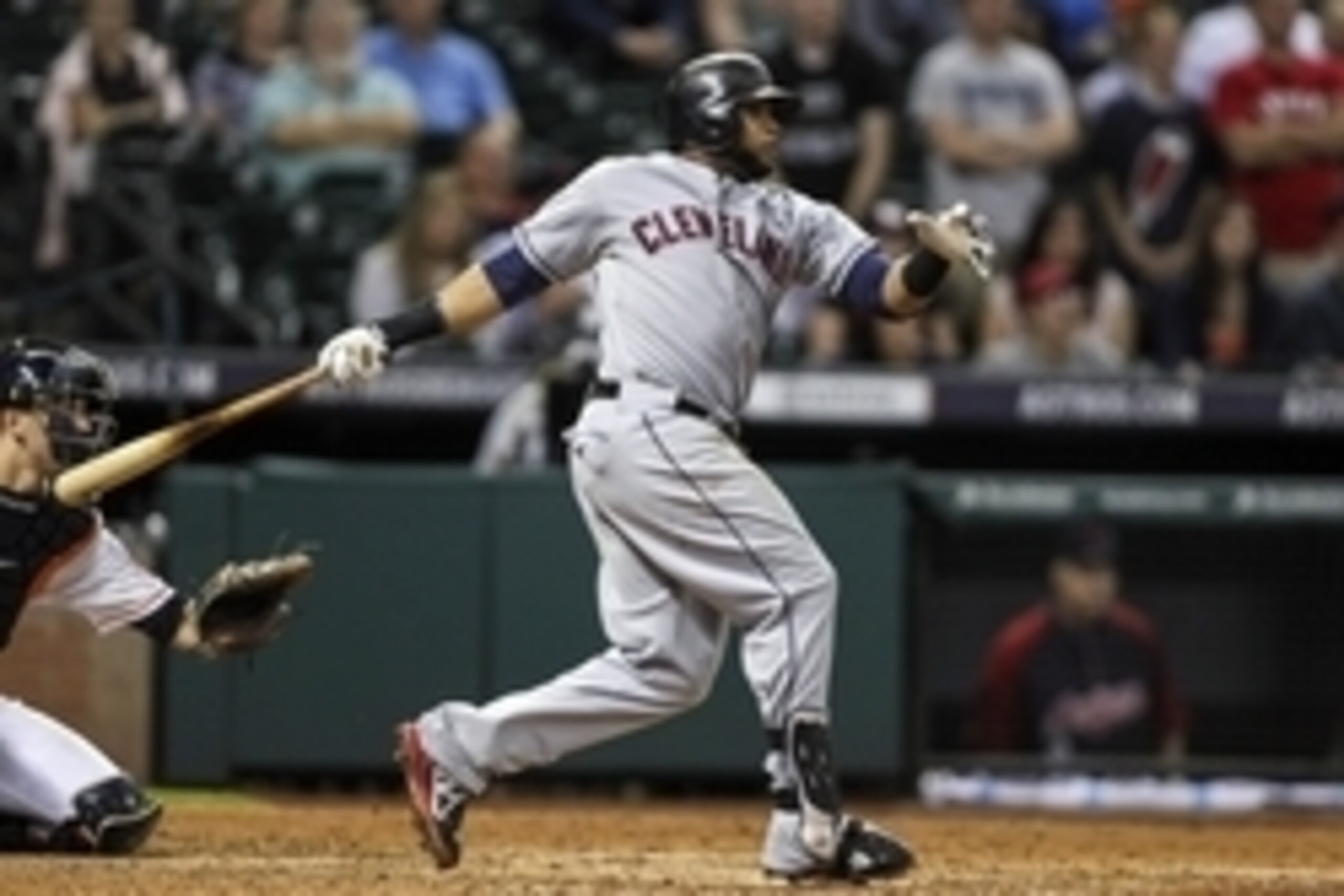 Sep 18, 2014; Houston, TX, USA; Cleveland Indians first baseman Carlos Santana (41) drives in a run with a single during the ninth inning against the Houston Astros at Minute Maid Park. Mandatory Credit: Troy Taormina-USA TODAY Sports