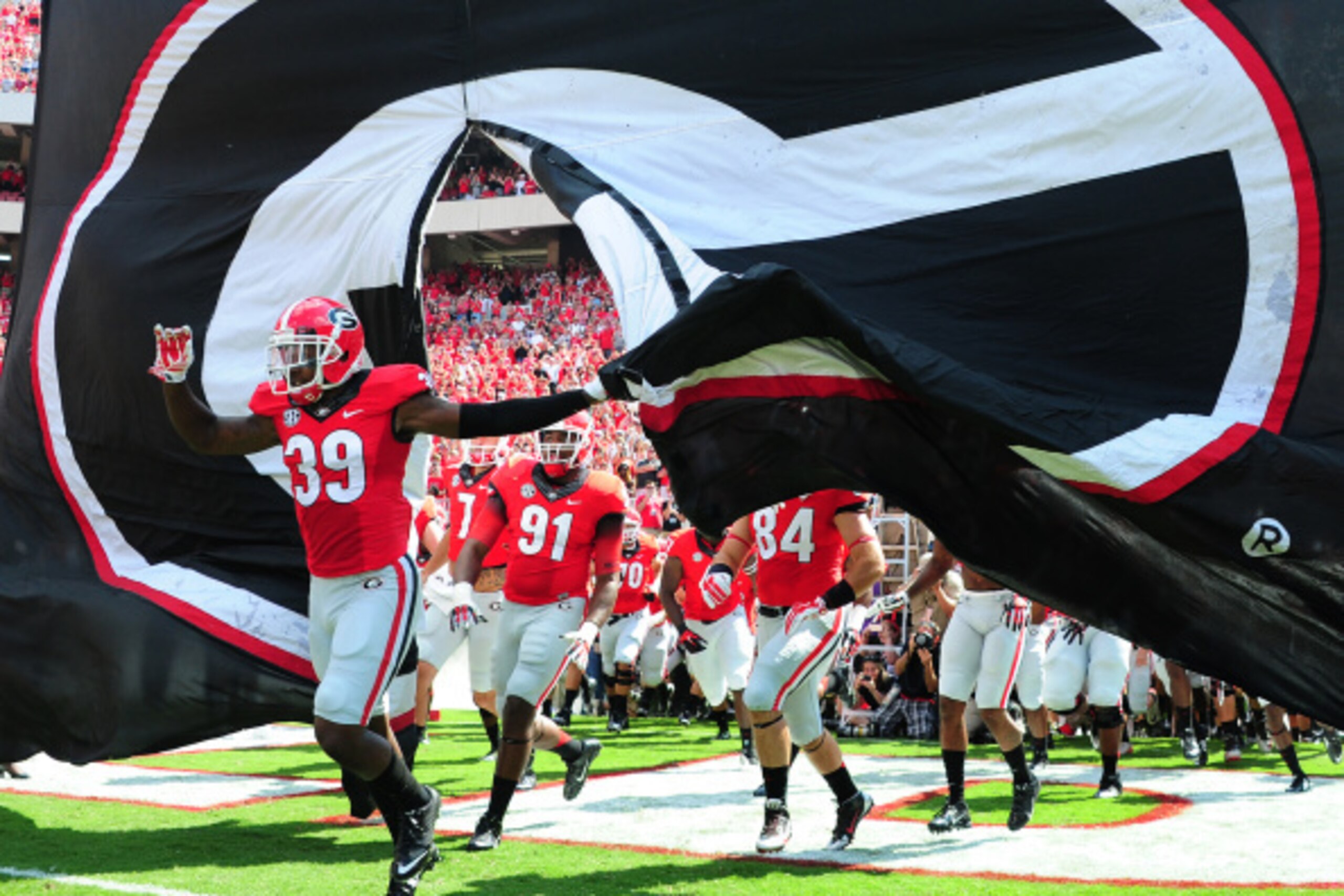 ATHENS, GA - SEPTEMBER 20: Corey Moore #39 of the Georgia Bulldogs leads his team on to the field to play the Troy Trojans at Sanford Stadium on September 20, 2014 in Athens, Georgia. (Photo by Scott Cunningham/Getty Images)