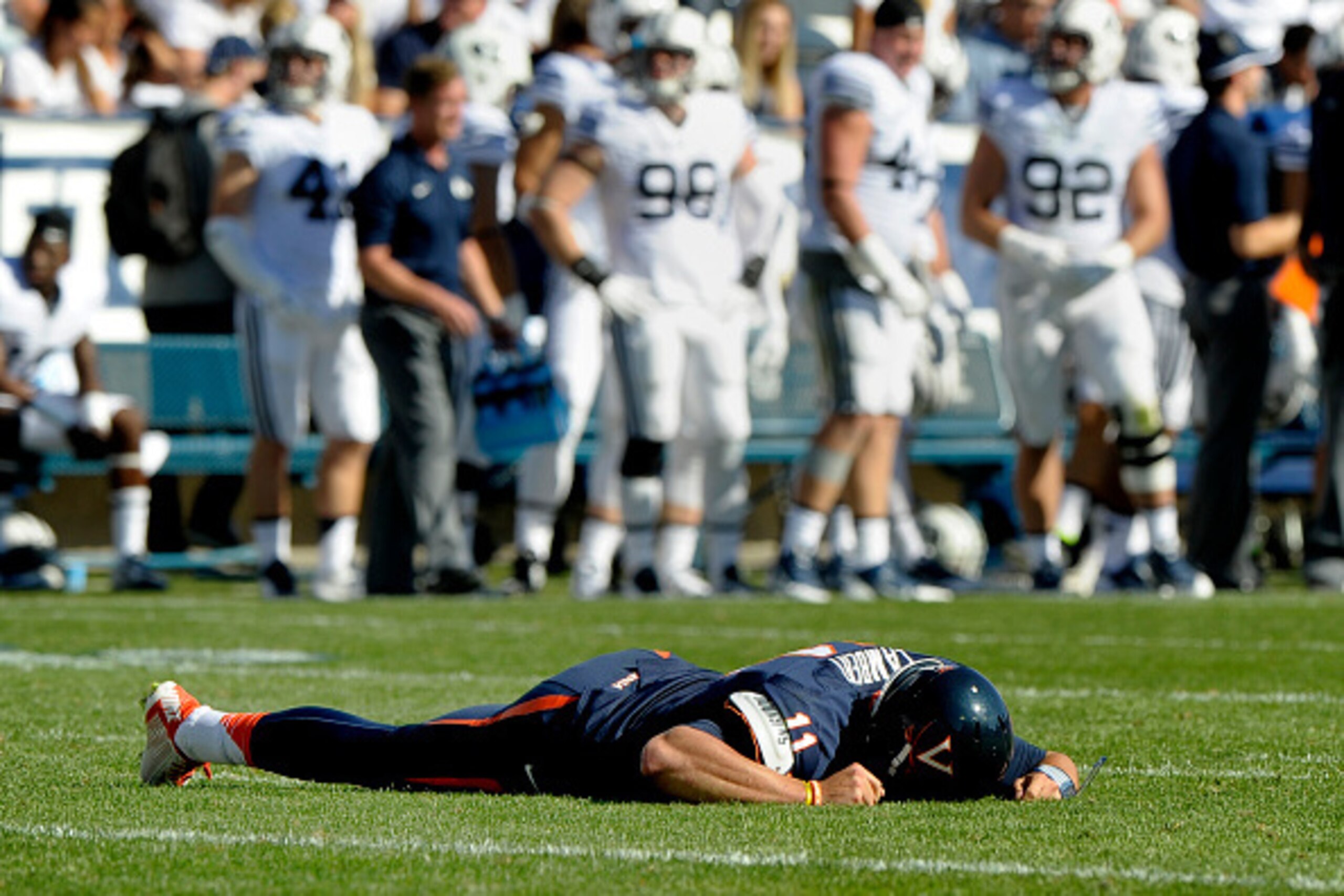 PROVO, UT - SEPTEMBER 20: Starting quarterback Greyson Lambert #11 of the Virginia Cavaliers lays injured on the field, in the third quarter of their game against the Brigham Young Cougars at LaVell Edwards Stadium on September 20, 2014 in Provo, Utah. He