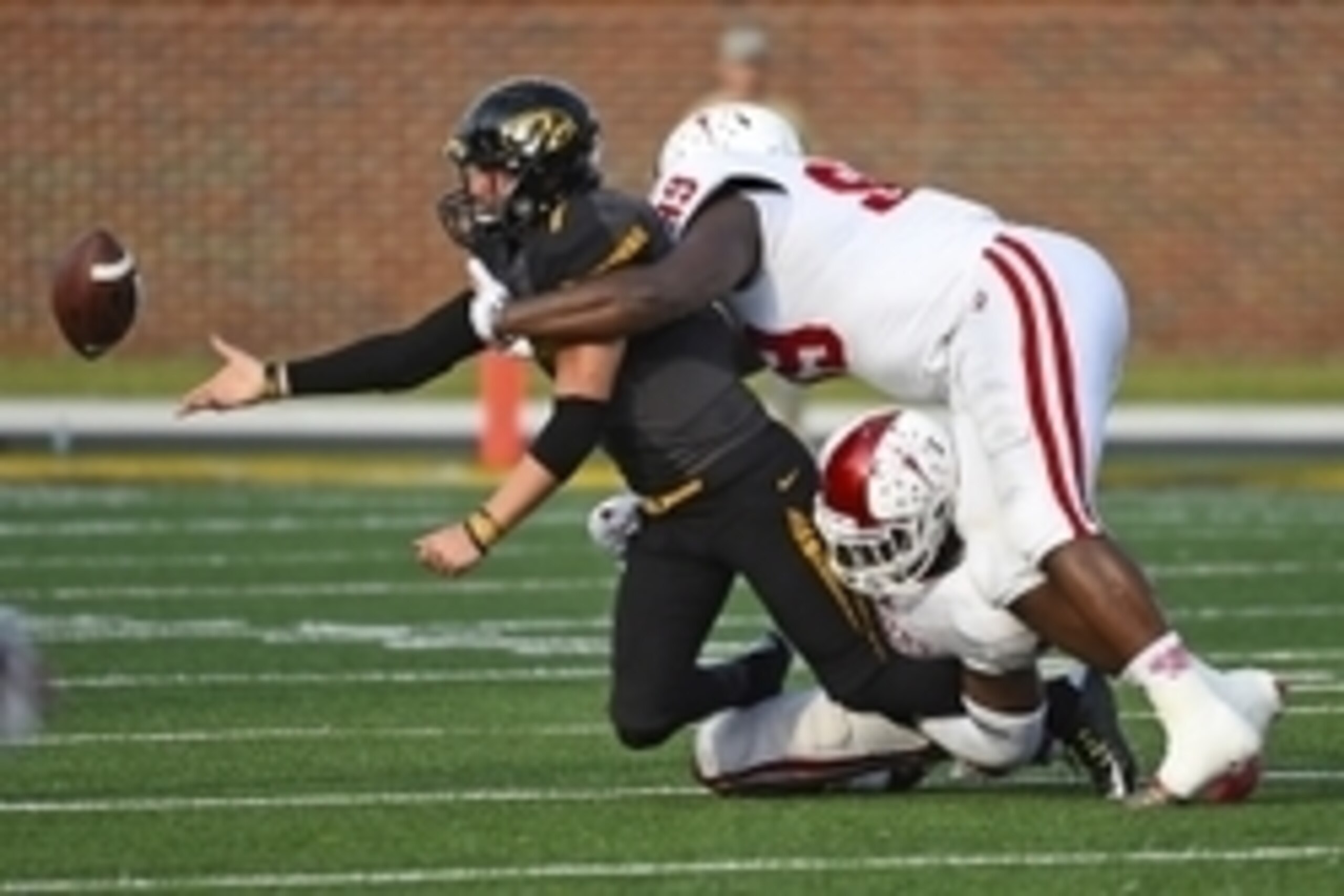 Sep 20, 2014; Columbia, MO, USA; Missouri Tigers quarterback Maty Mauk (7) attempts to pass the ball before being taken down by Indiana Hoosiers linebacker Clyde Newton (41) and defensive tackle Adarius Rayner (99) during the second half at Faurot Field. 