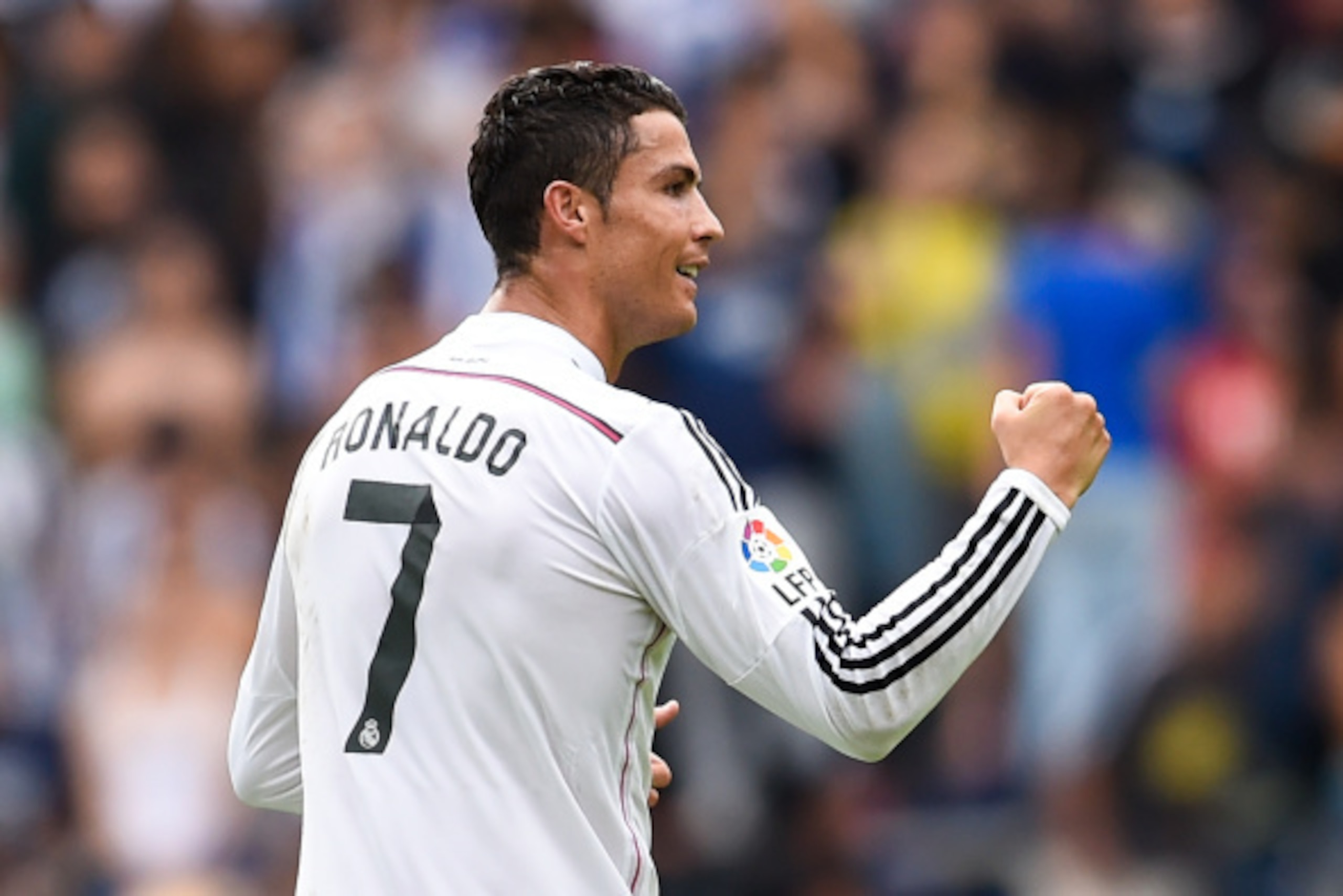 LA CORUNA, SPAIN - SEPTEMBER 20:  Cristiano Ronaldo of Real Madrid CF celebrates after scoring the opening goal  during the La Liga match between RC Deportivo La Coruna and Real Madrid CF at Riazor Stadium on September 20, 2014 in La Coruna, Spain.  (Phot