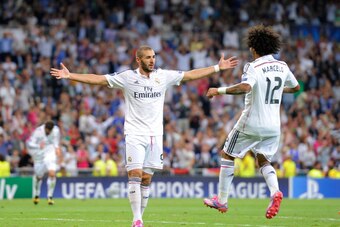 MADRID, SPAIN - SEPTEMBER 16:  Karim Benzema of Real Madrid celebrates with Marcelo after scoring Real's 5th goal during the UEFA Champions League Group B match between Real Madrid CF and FC Basel 1893 on September 16, 2014 in Madrid, Spain.  (Photo by De