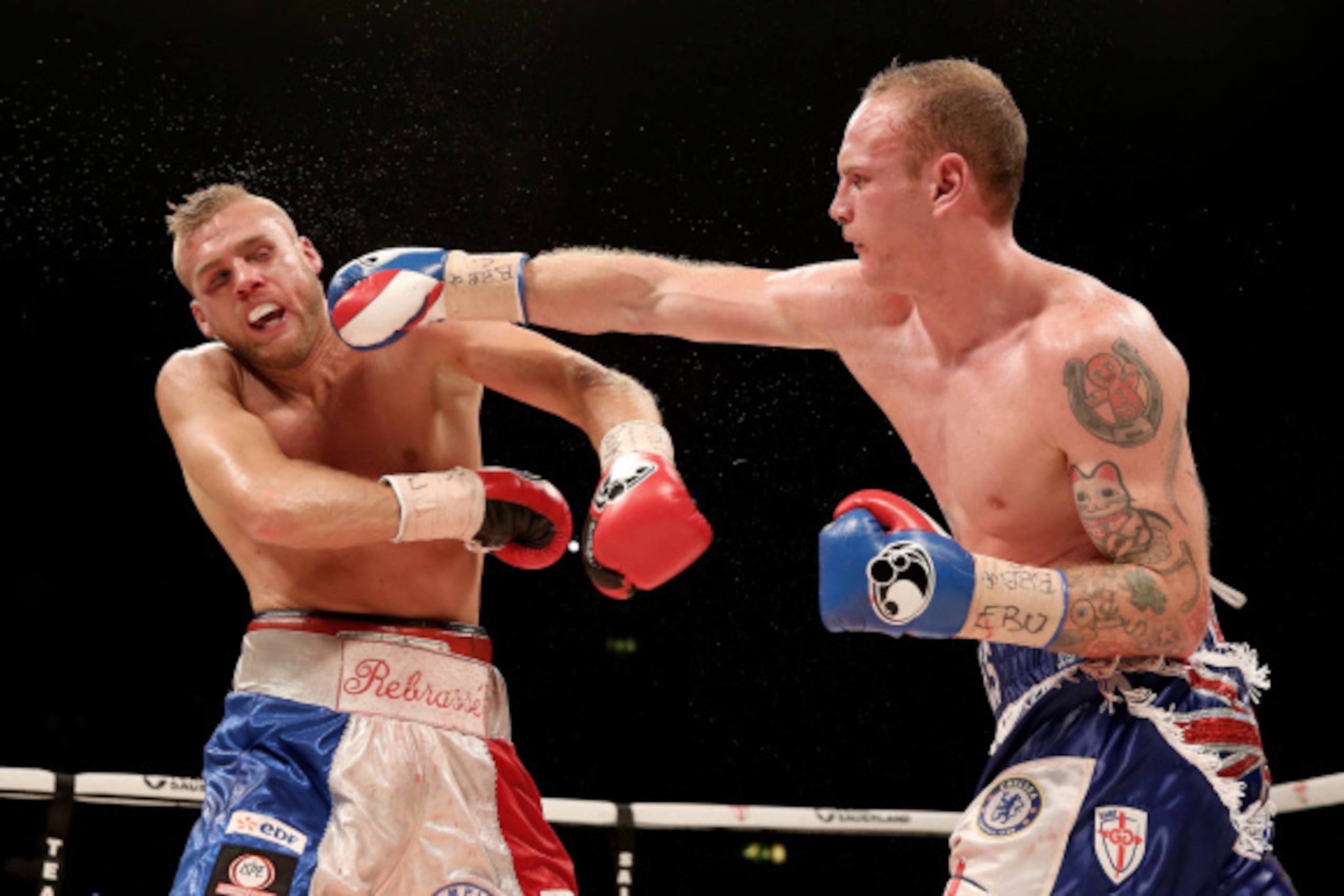 LONDON, ENGLAND - SEPTEMBER 20:  George Groves in action with Christopher Rebrasse during their WBC Final Eliminator & European Super Middleweight bout at Wembley Arena on September 20, 2014 in London, England.  (Photo by Scott Heavey/Getty Images)