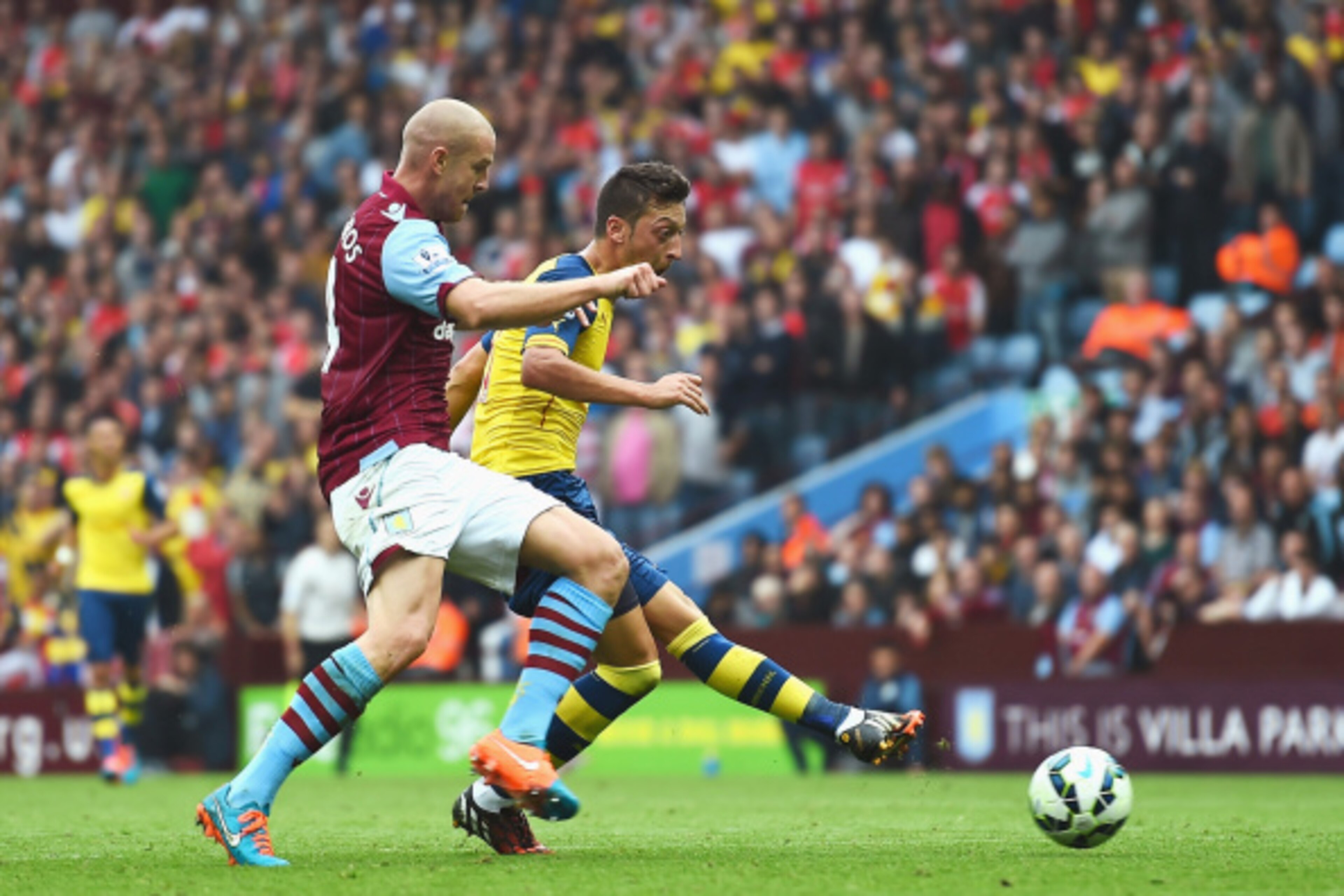 BIRMINGHAM, ENGLAND - SEPTEMBER 20:  Mesut Oezil of Arsenal scores the opening goal during the Barclays Premier League match between Aston Villa and Arsenal at Villa Park on September 20, 2014 in Birmingham, England.  (Photo by Laurence Griffiths/Getty Im