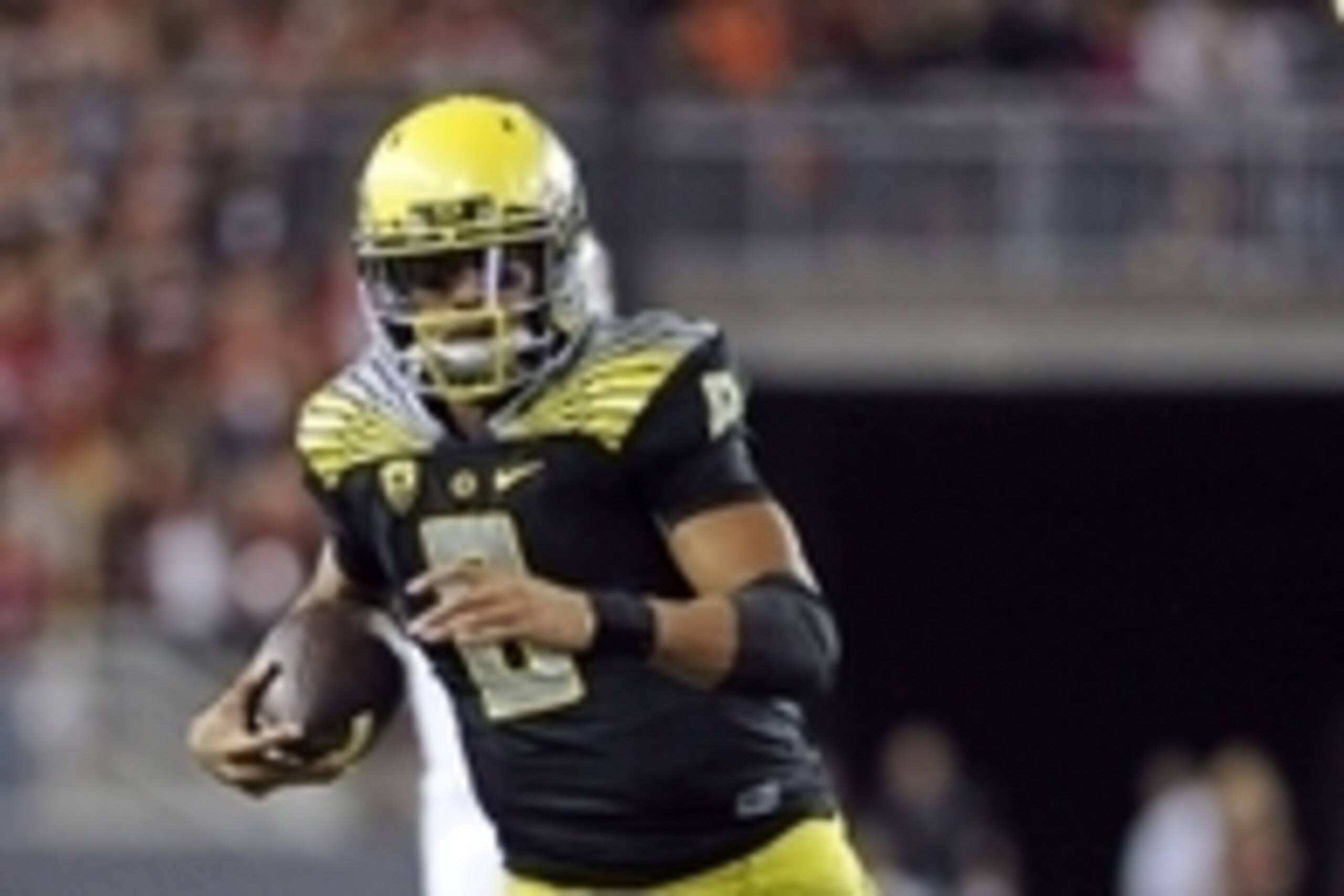Sep 20, 2014; Pullman, WA, USA; Oregon Ducks quarterback Marcus Mariota (8) scrambles out of the packet against the Washington State Cougars during the second half at Martin Stadium. The Ducks beat Cougars 38-31. Mandatory Credit: James Snook-USA TODAY Sp