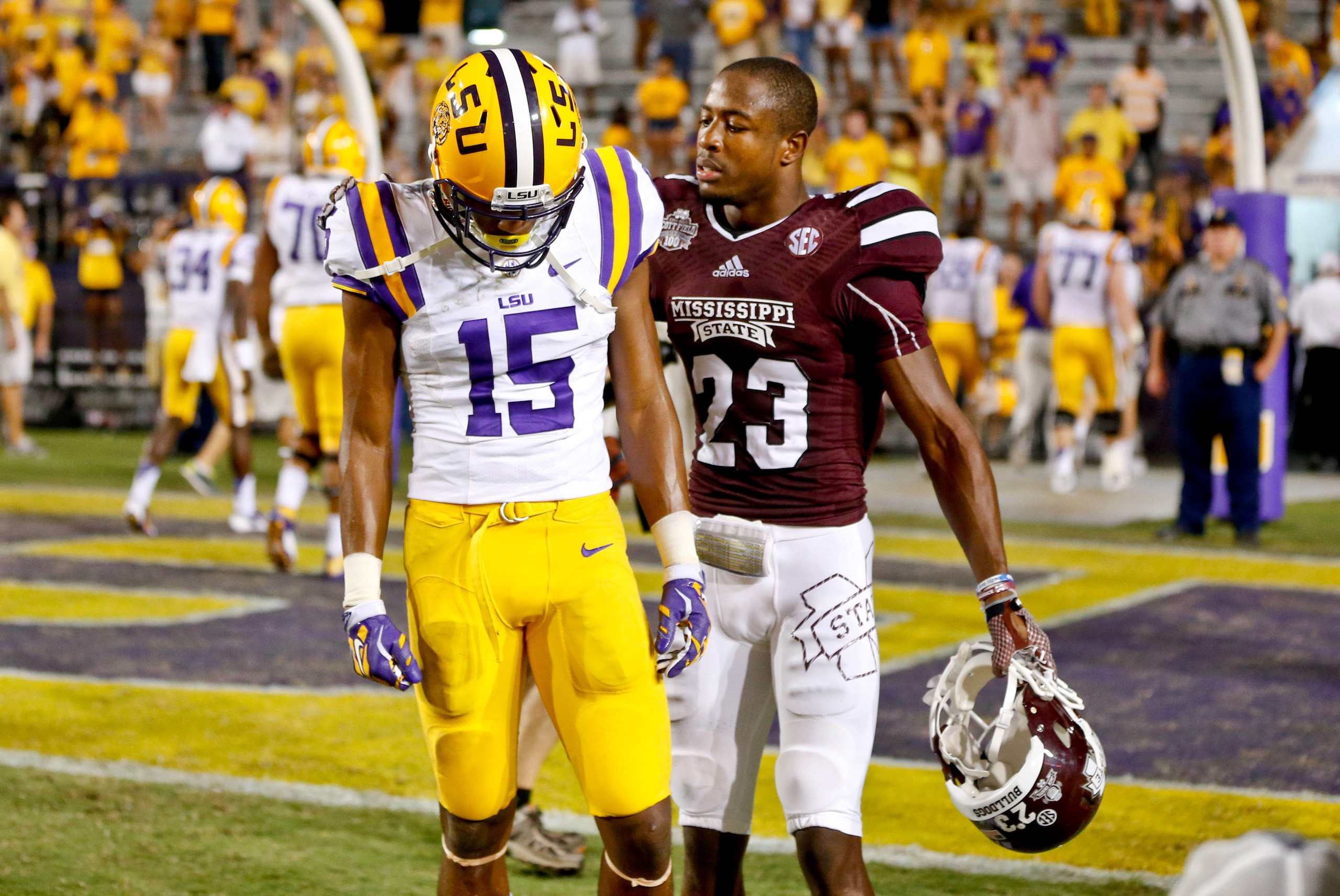 Sep 20, 2014; Baton Rouge, LA, USA; Mississippi State Bulldogs defensive back Taveze Calhoun (23) talks with LSU Tigers wide receiver Malachi Dupre (15) following the game at Tiger Stadium. Mississippi State defeated LSU 34-29. Mandatory Credit: Derick E. Sep 20, 2014; Baton Rouge, LA, USA; Mississippi State Bulldogs defensive back Taveze Calhoun (23) talks with LSU Tigers wide receiver Malachi Dupre (15) following the game at Tiger Stadium. Mississippi State defeated LSU 34-29. Mandatory Credit: Derick E.