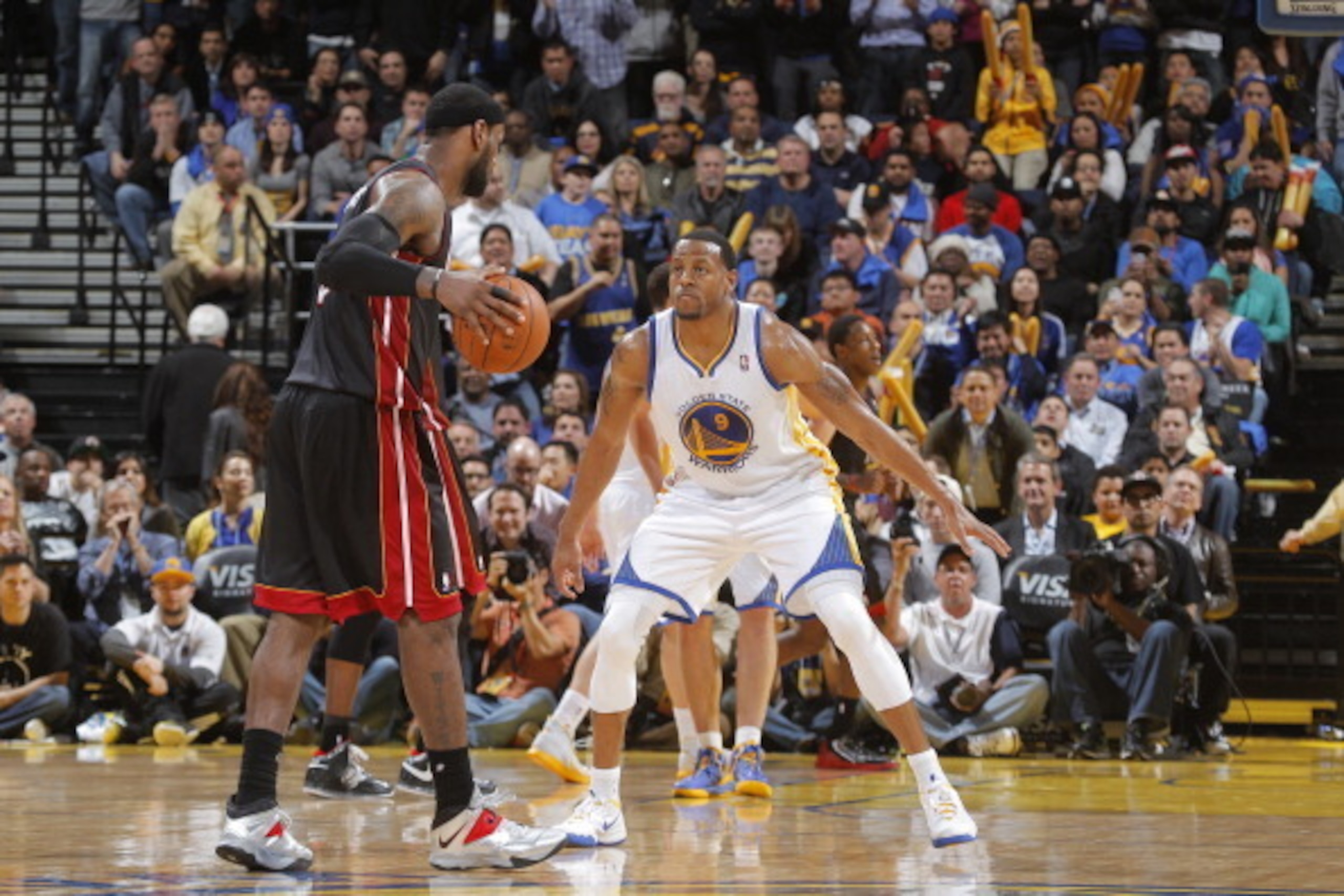 OAKLAND, CA - FEBRUARY 12: LeBron James #6 of the Miami Heat faces off against Andre Iguodala #9 of the Golden State Warriors on February 12, 2014 at Oracle Arena in Oakland, California. NOTE TO USER: User expressly acknowledges and agrees that, by downlo
