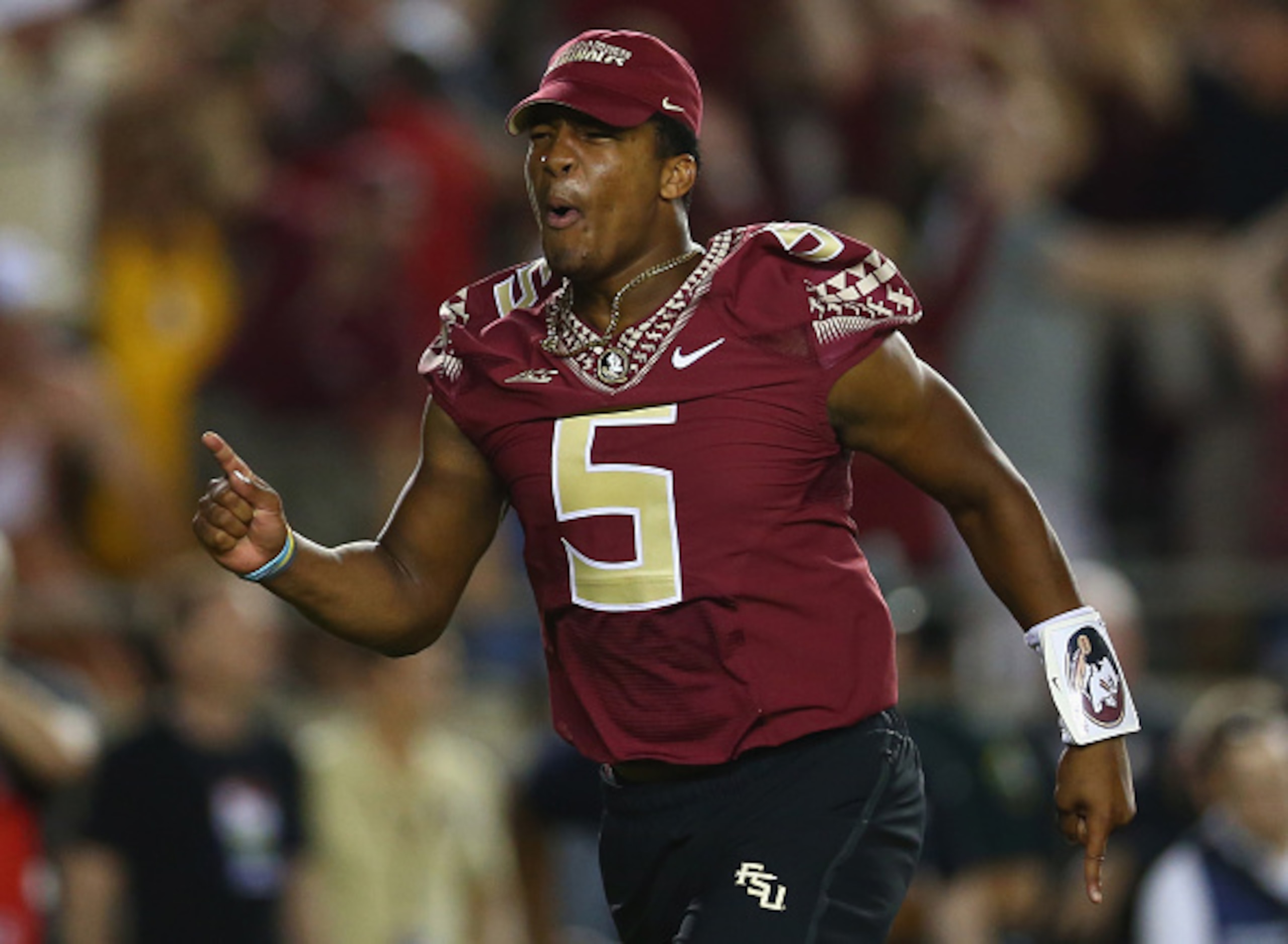 TALLAHASSEE, FL - SEPTEMBER 20: Jameis Winston #5 of the Florida State Seminoles runs on the field to celebrate the overtime win against the Clemson Tigers at Doak Campbell Stadium on September 20, 2014 in Tallahassee, Florida. (Photo by Ronald Martinez TALLAHASSEE, FL - SEPTEMBER 20: Jameis Winston #5 of the Florida State Seminoles runs on the field to celebrate the overtime win against the Clemson Tigers at Doak Campbell Stadium on September 20, 2014 in Tallahassee, Florida. (Photo by Ronald Martinez
