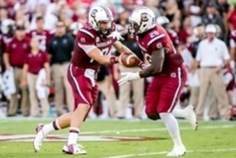 Aug 28, 2014; Columbia, SC, USA; South Carolina Gamecocks quarterback Dylan Thompson (17) hands off to South Carolina Gamecocks running back Mike Davis (28) in the second quarter at Williams-Brice Stadium. Mandatory Credit: Jeff Blake-USA TODAY Sports