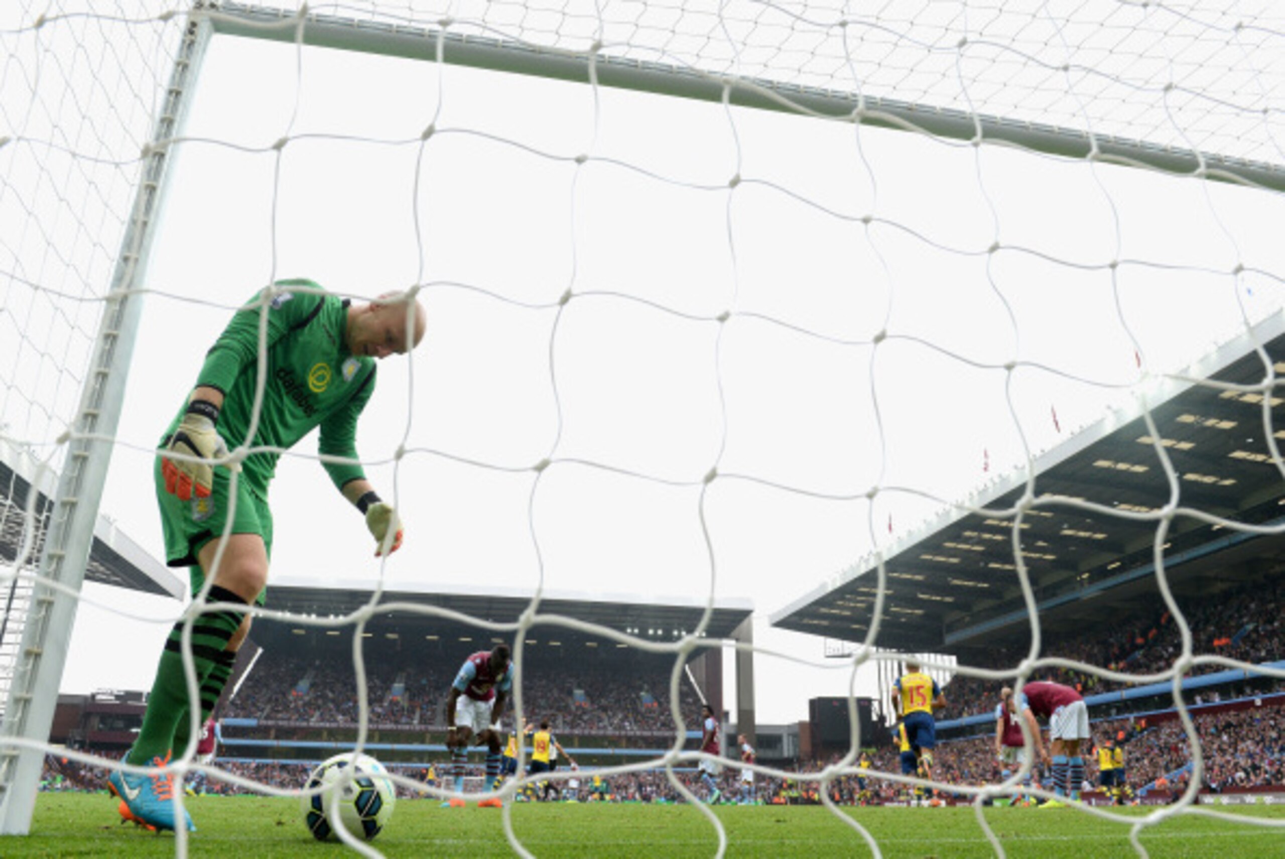BIRMINGHAM, ENGLAND - SEPTEMBER 20:  Brad Guzan of Aston Villa collects the ball after an own goal by Aly Cissokho of Aston Villa during the Barclays Premier League match between Aston Villa and Arsenal at Villa Park on September 20, 2014 in Birmingham, E